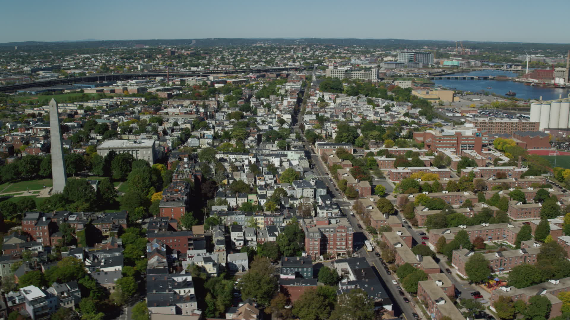 5.5K stock footage aerial video orbiting Bunker Hill Monument, apartments, row houses