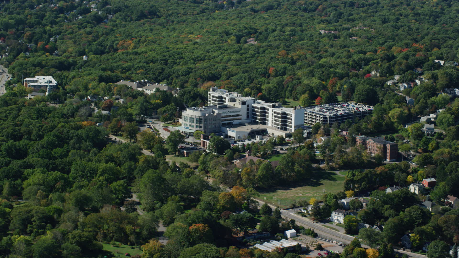 5.5K stock footage aerial video flying by Faulkner Hospital, colorful
