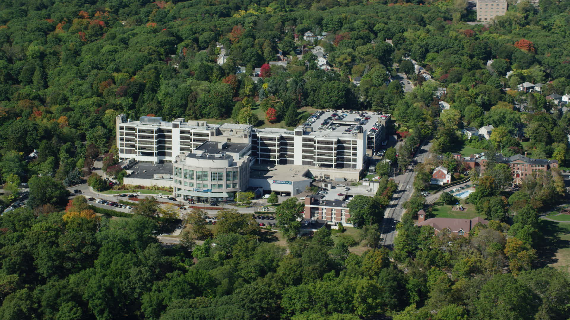 5.5K stock footage aerial video flying by Faulkner Hospital, colorful trees, autumn, Jamaica