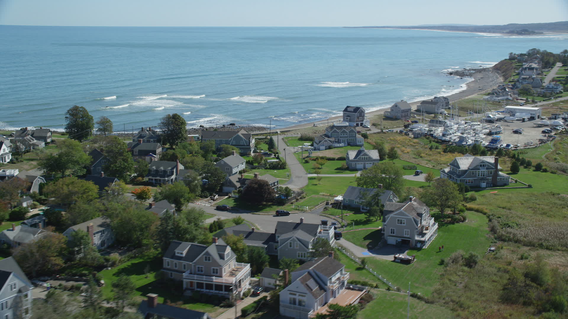 5.5K stock footage aerial video flying by beach, oceanfront homes