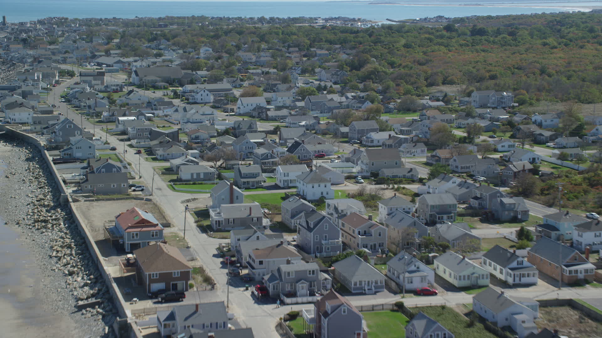 6K stock footage aerial video flying over oceanfront homes, small