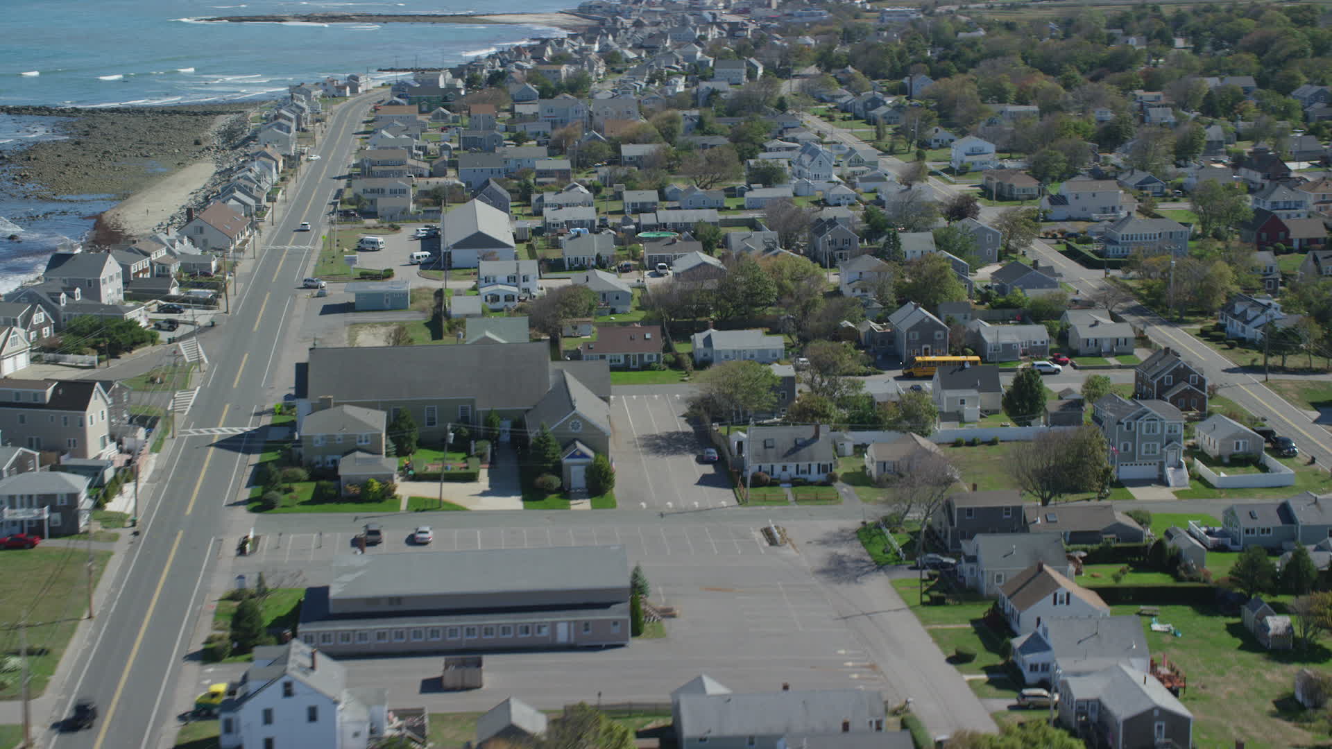 5.5K stock footage aerial video flying by oceanfront homes, small