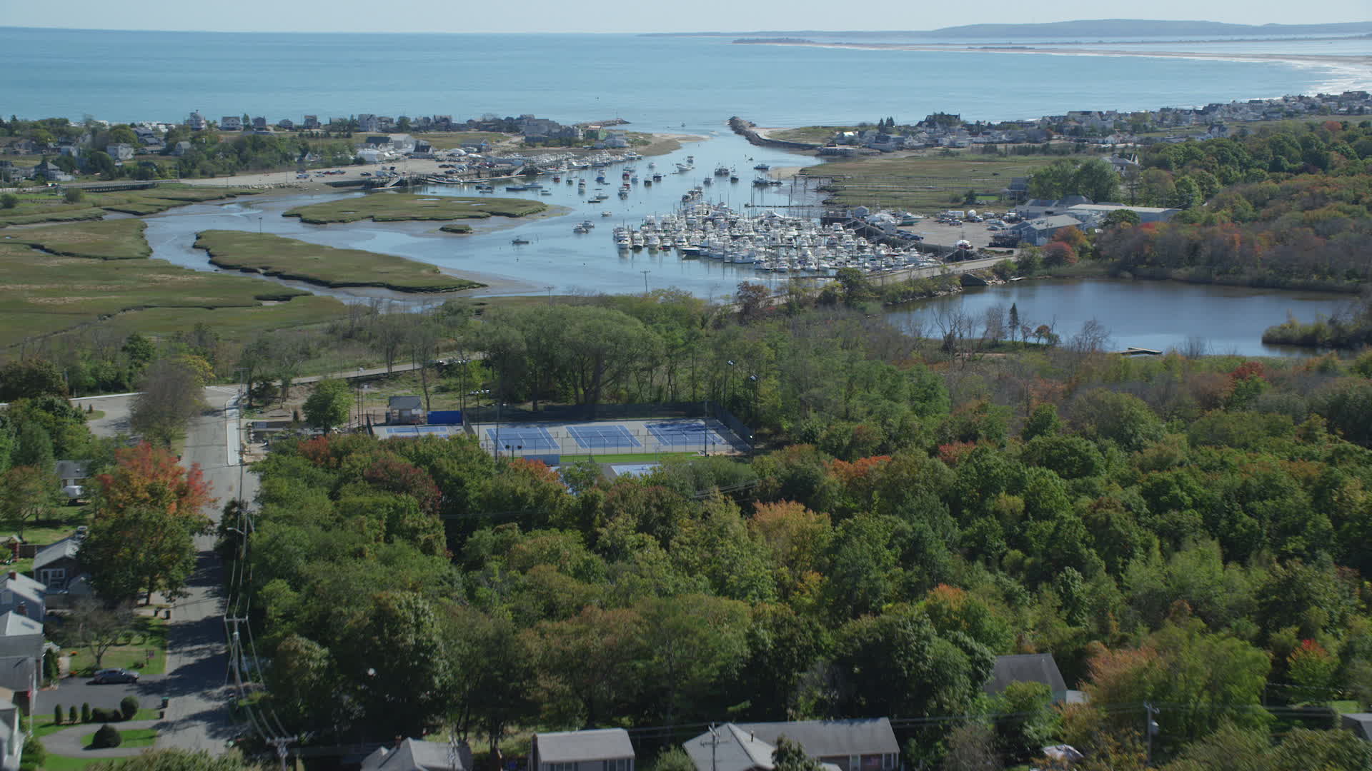 6K stock footage aerial video flying over small town, approaching