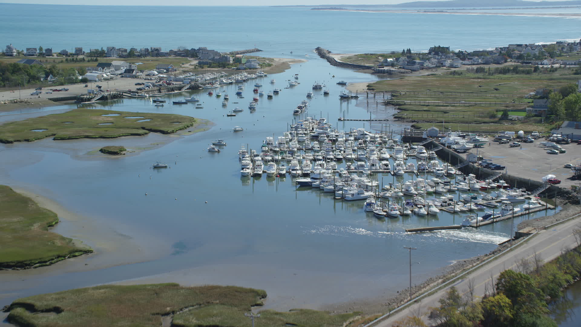 6K stock footage aerial video flying over a small marina 