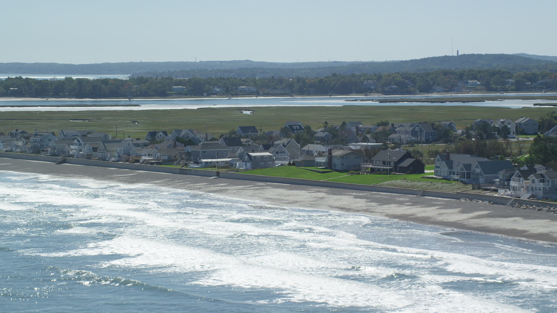 5.5K stock footage aerial video approaching beachfront homes, rolling