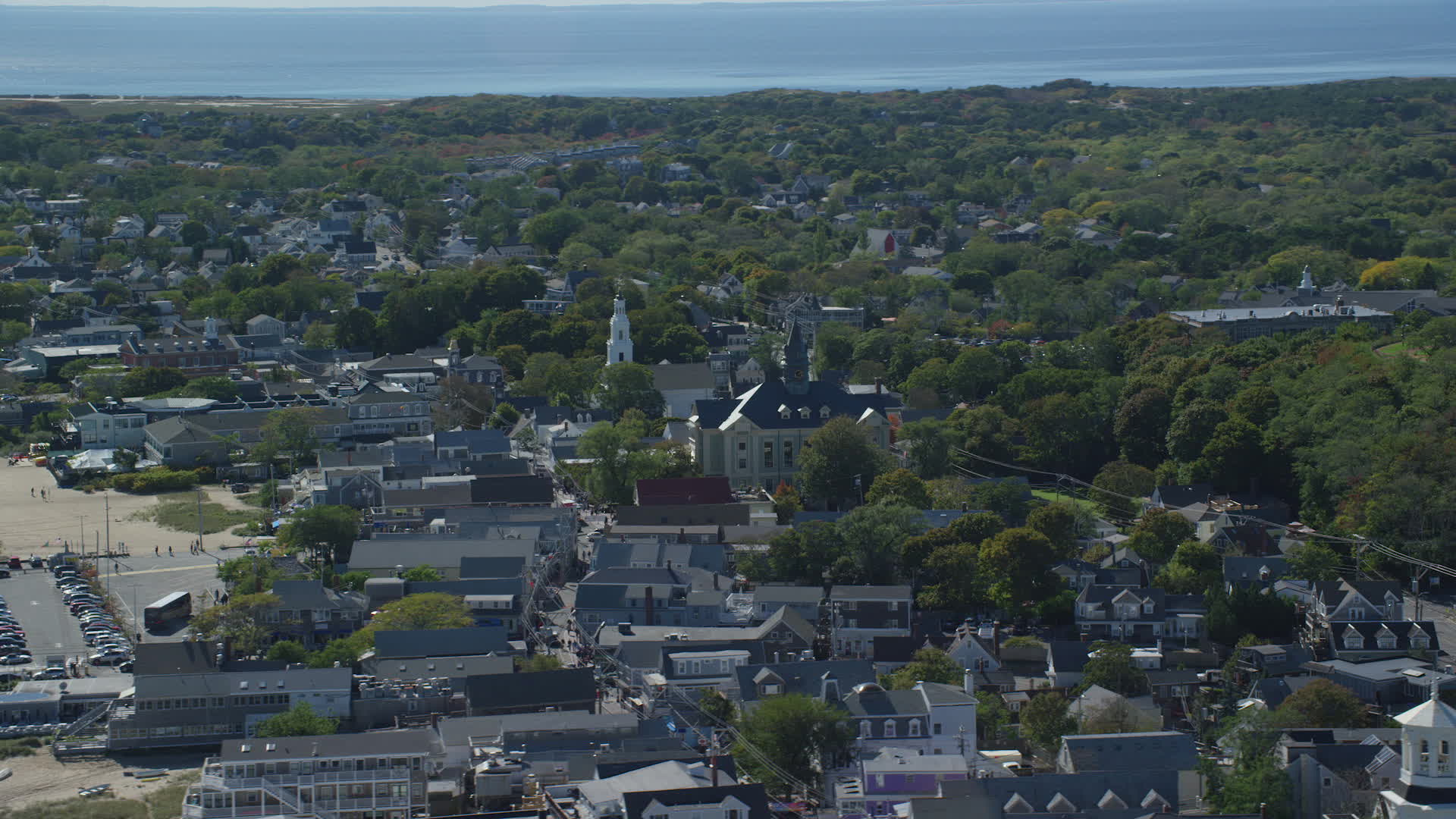 5.5K stock footage aerial video flying by small coastal town