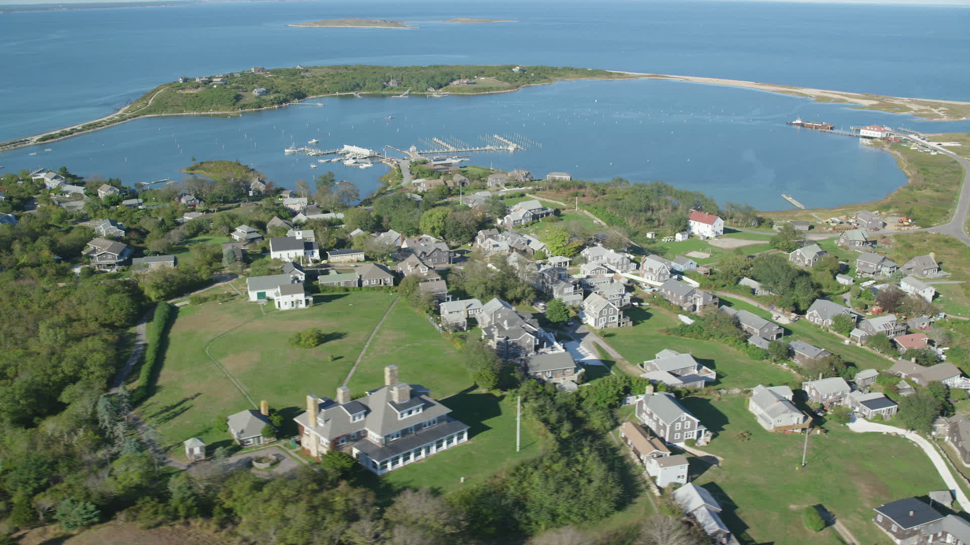 5.5K stock footage aerial video of a coastal community near pond