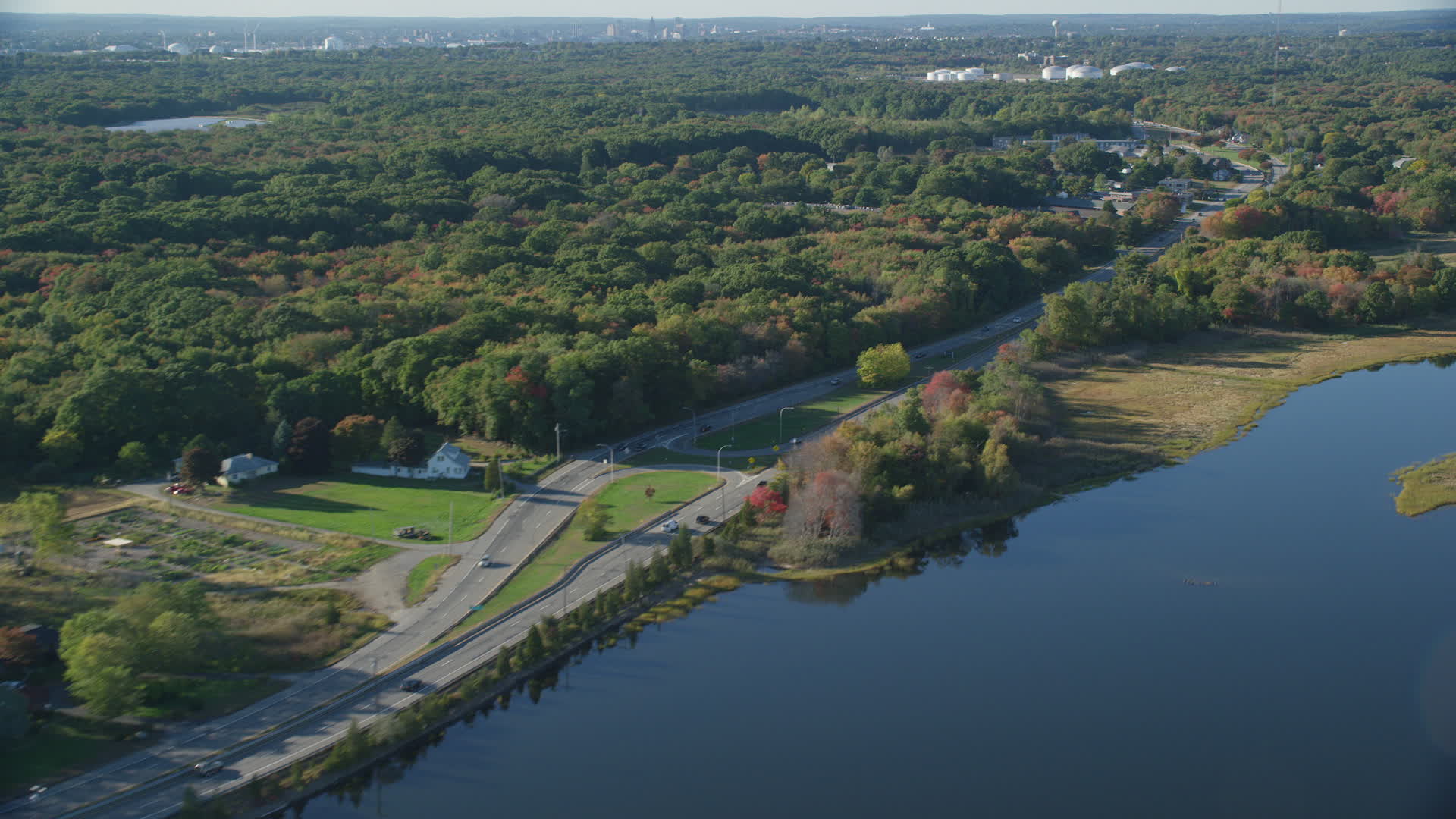 6k stock footage aerial video flying by Wampanoag Trail, dense trees