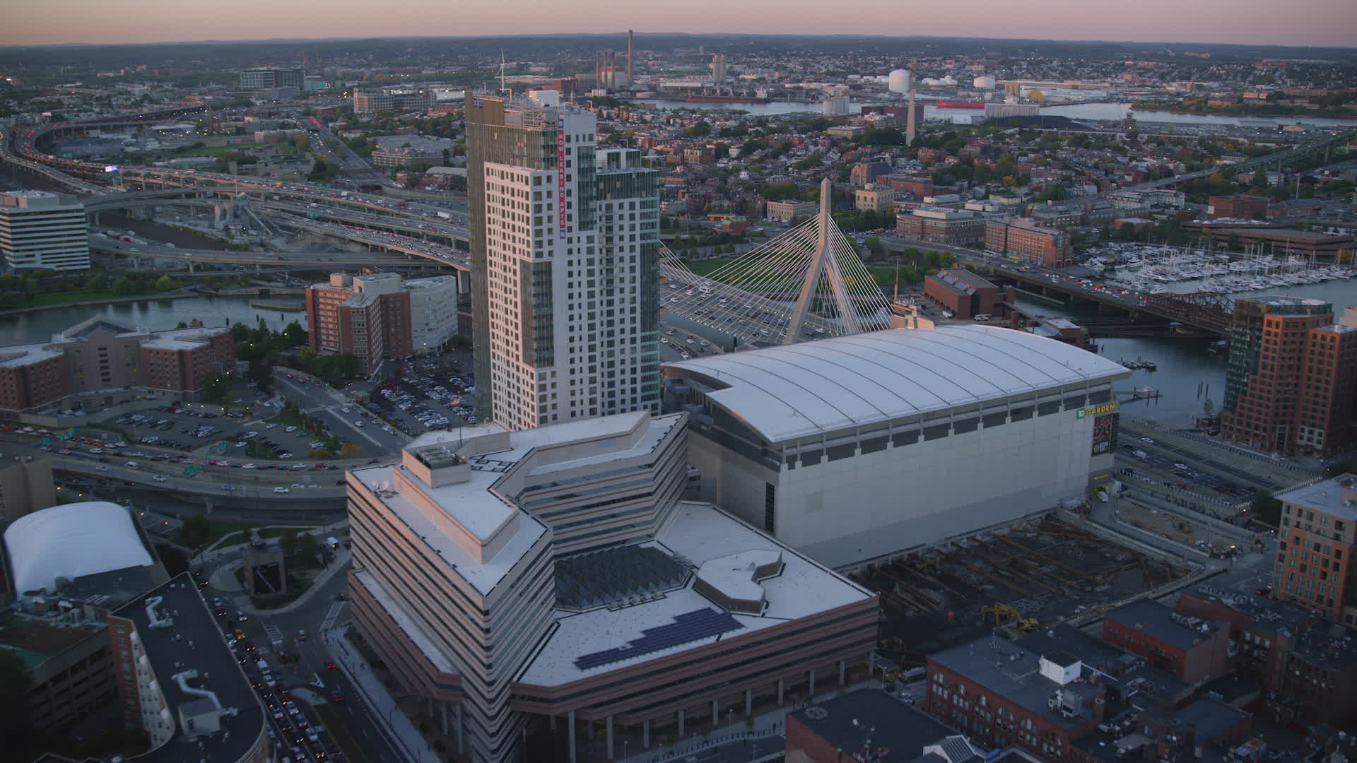6k stock footage aerial video flying over TD Garden, approaching Zakim