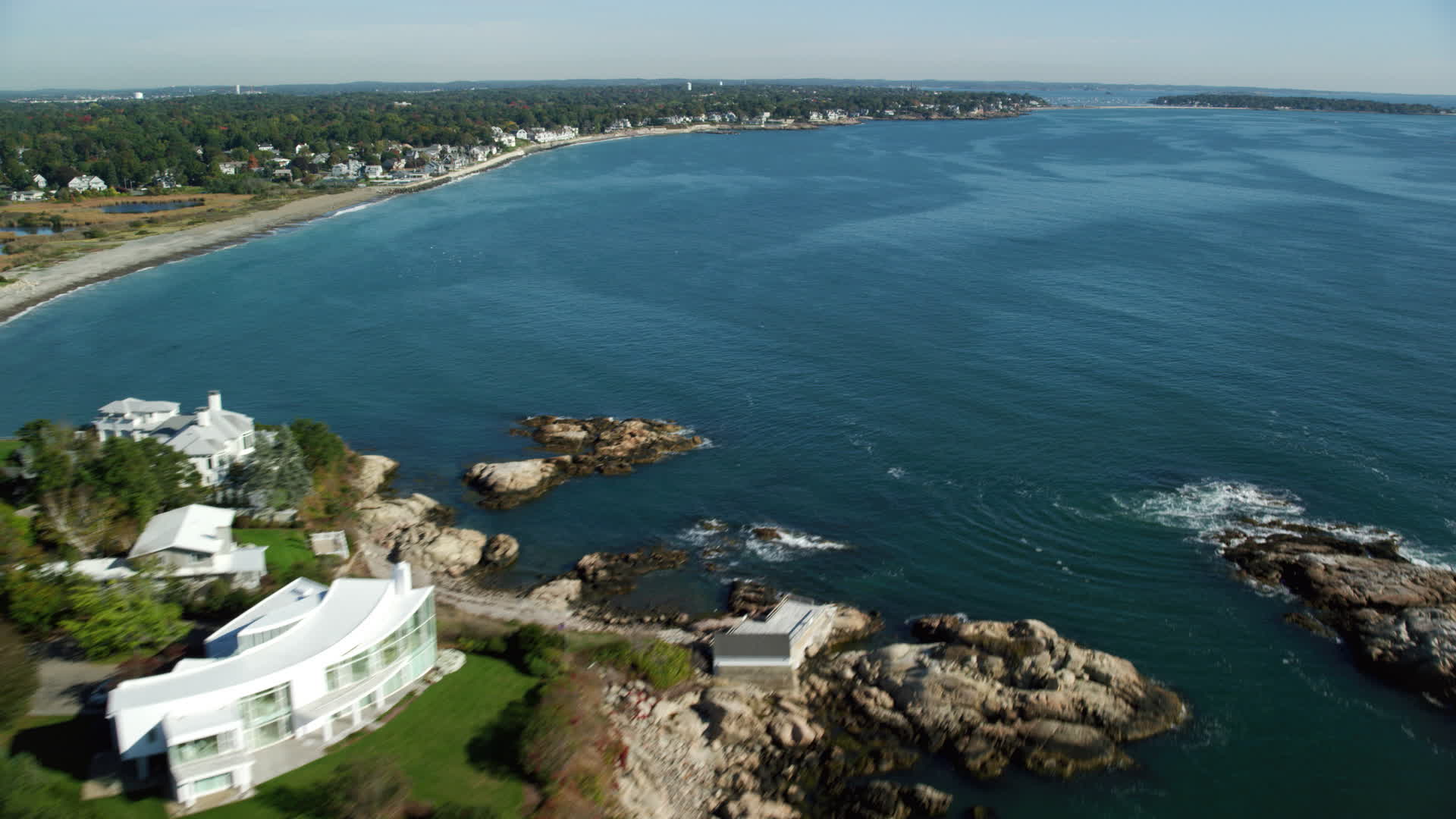 6k stock footage aerial video flying over a coastal community on