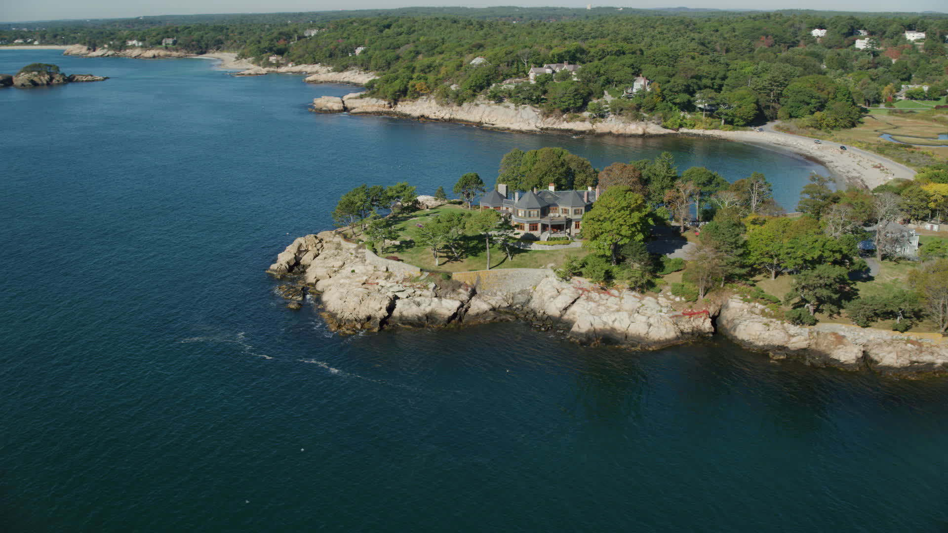 6k stock footage aerial video orbiting an oceanfront mansion