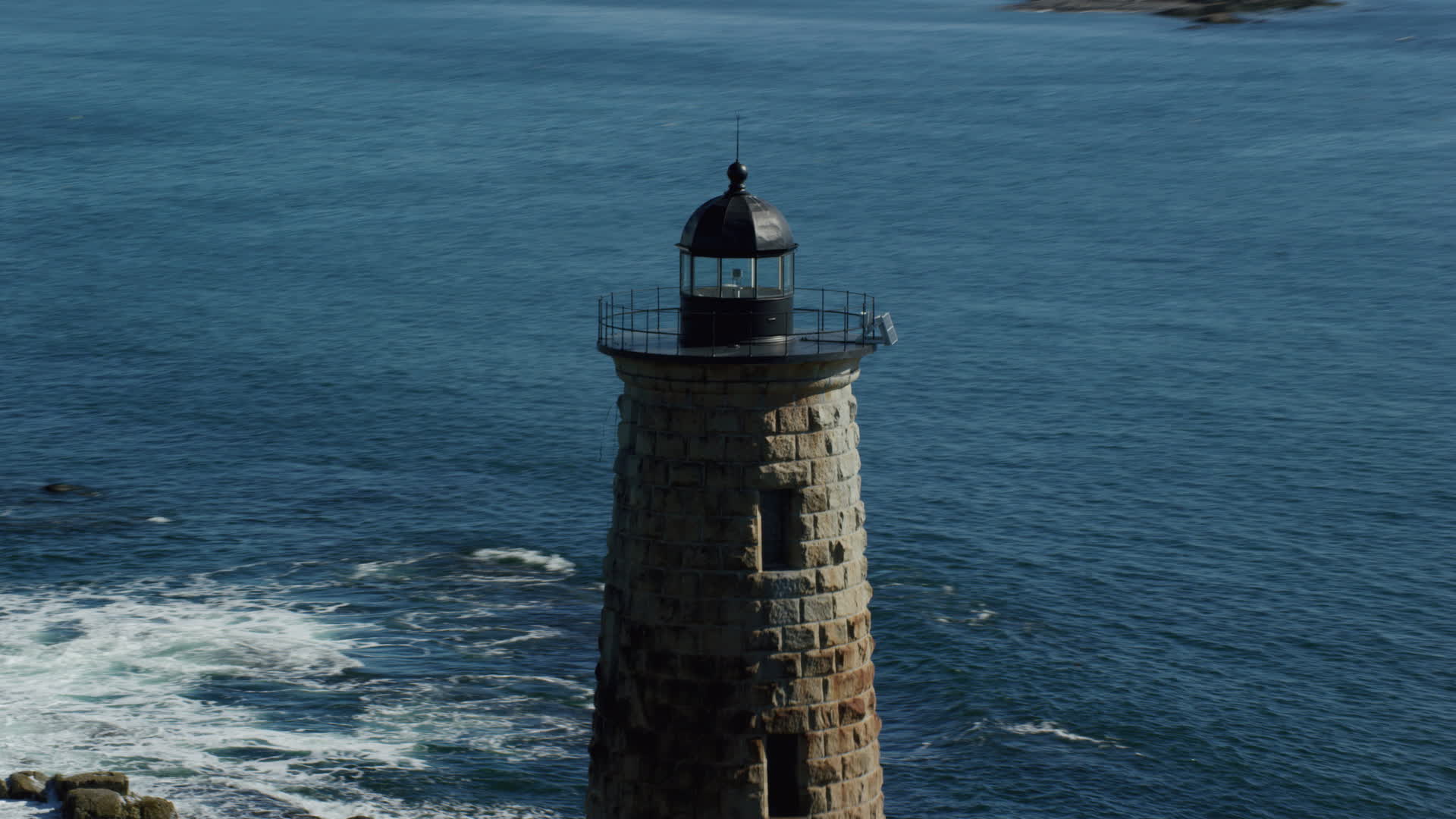 6k stock footage aerial video approaching and orbiting a lighthouse in the water, Kittery, Maine