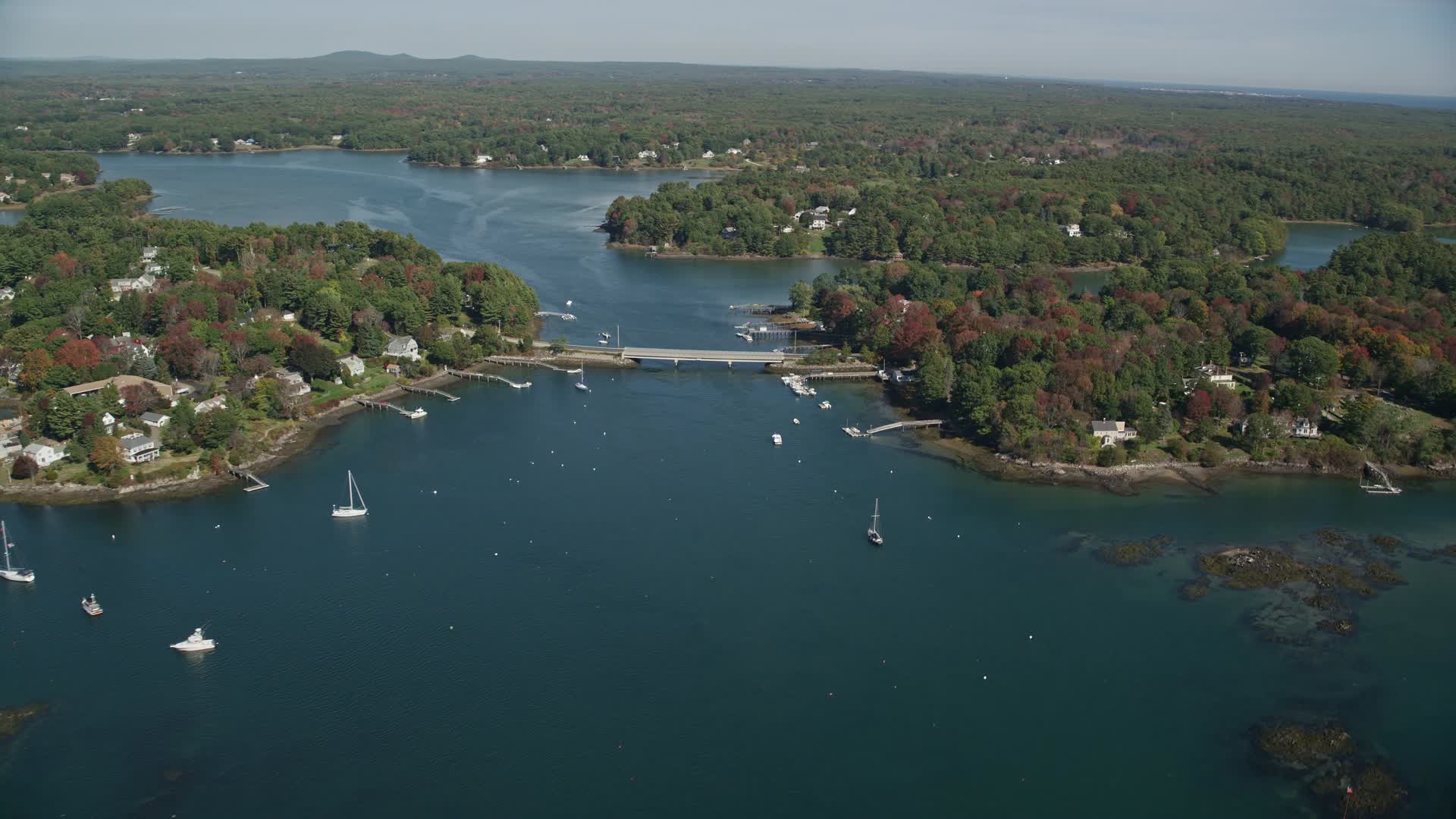 6k stock footage aerial video flying by small bridge, waterfront communities, autumn, Kittery