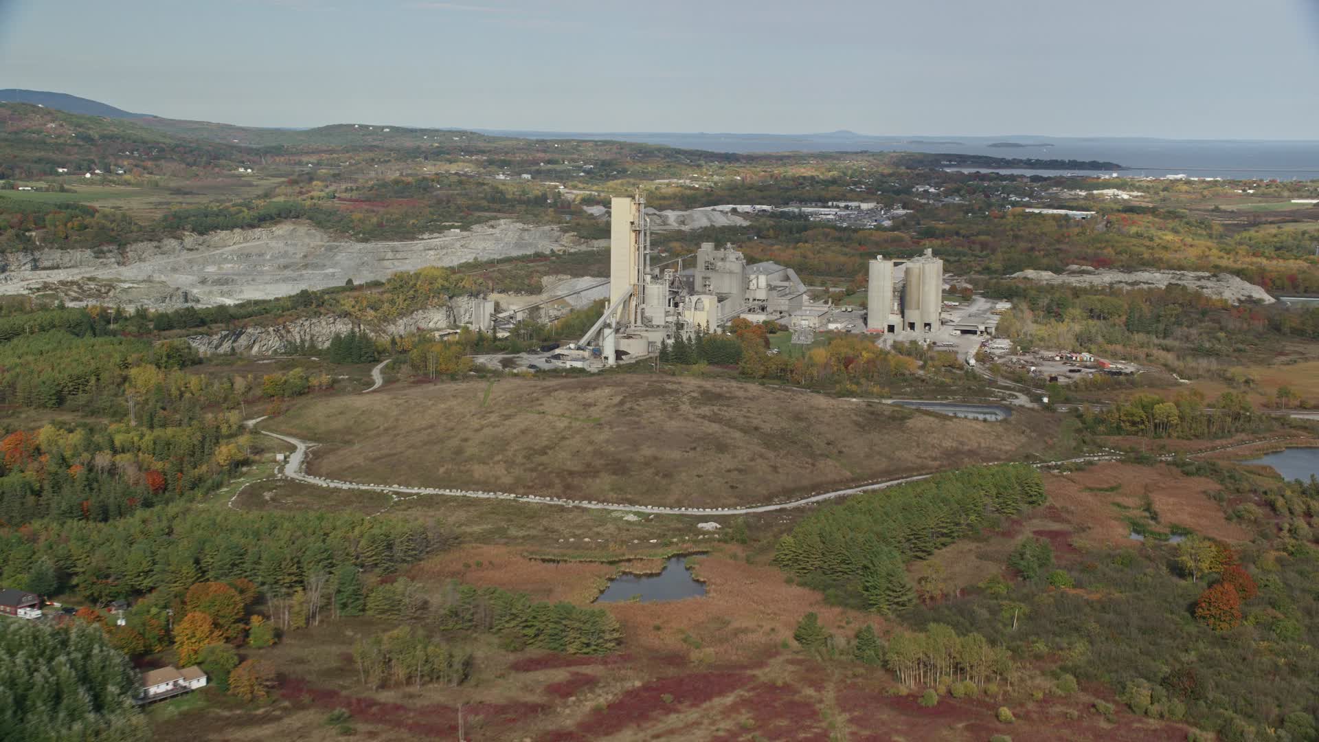 6k stock footage aerial video flying by quarry and factory, autumn