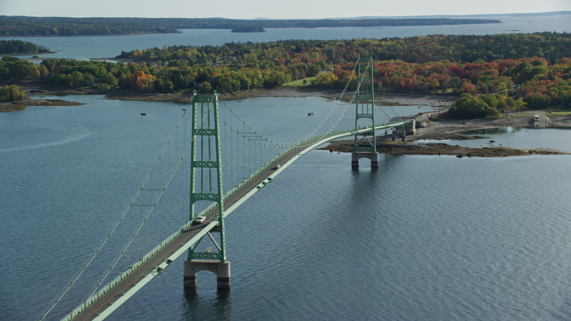 6k stock footage aerial video orbiting the Deer Isle Bridge, colorful
