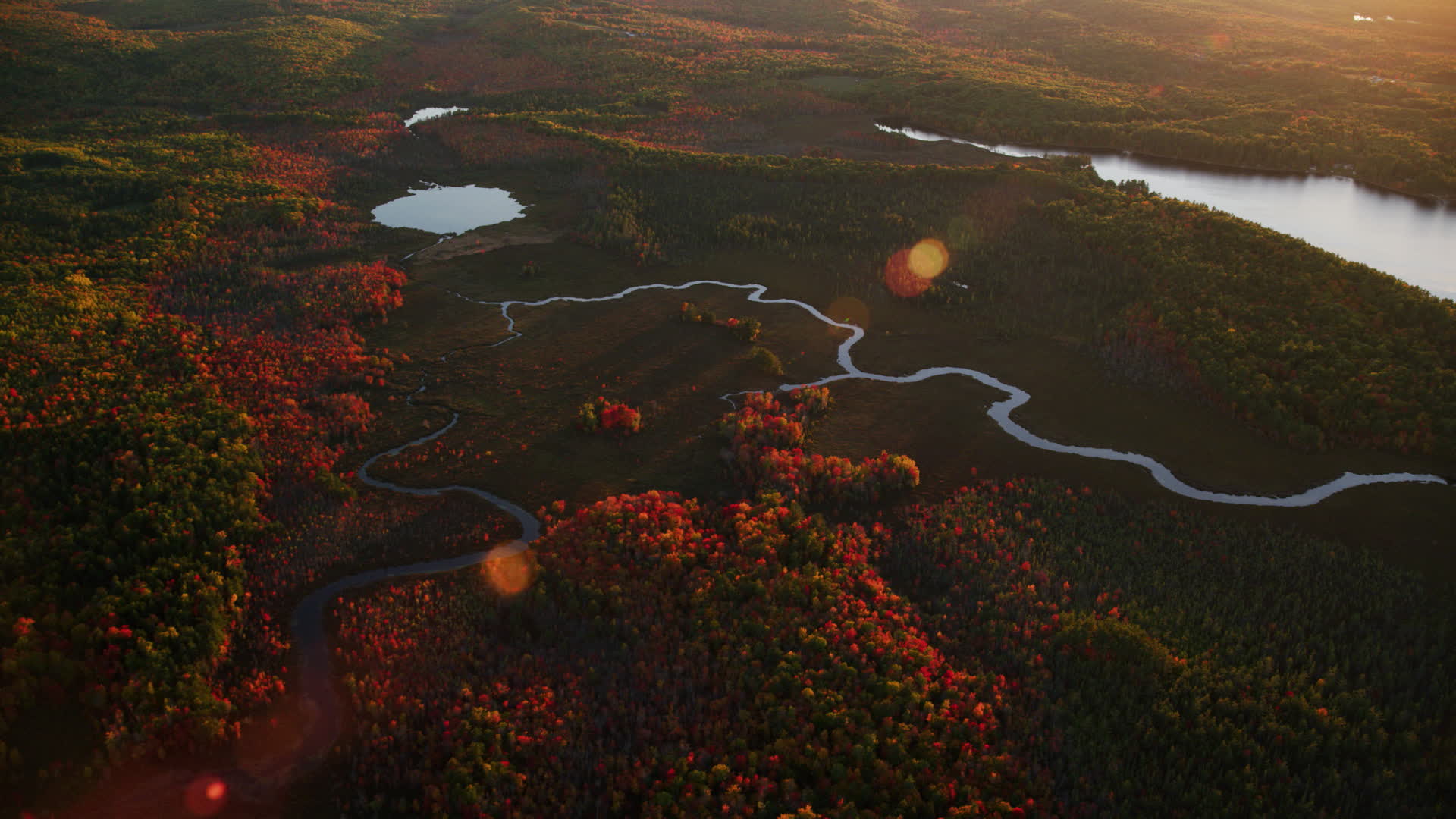 6K stock footage aerial video flying by rivers near pond, colorful