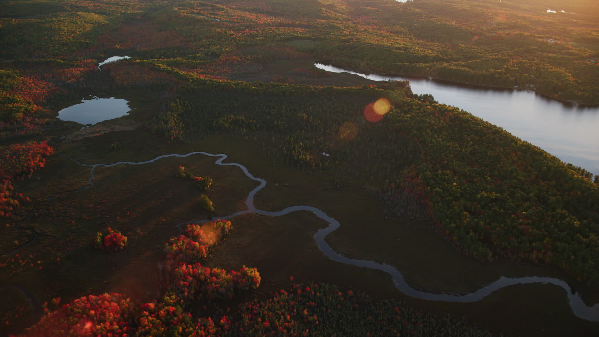 6K stock footage aerial video flying by river, pond, and colorful
