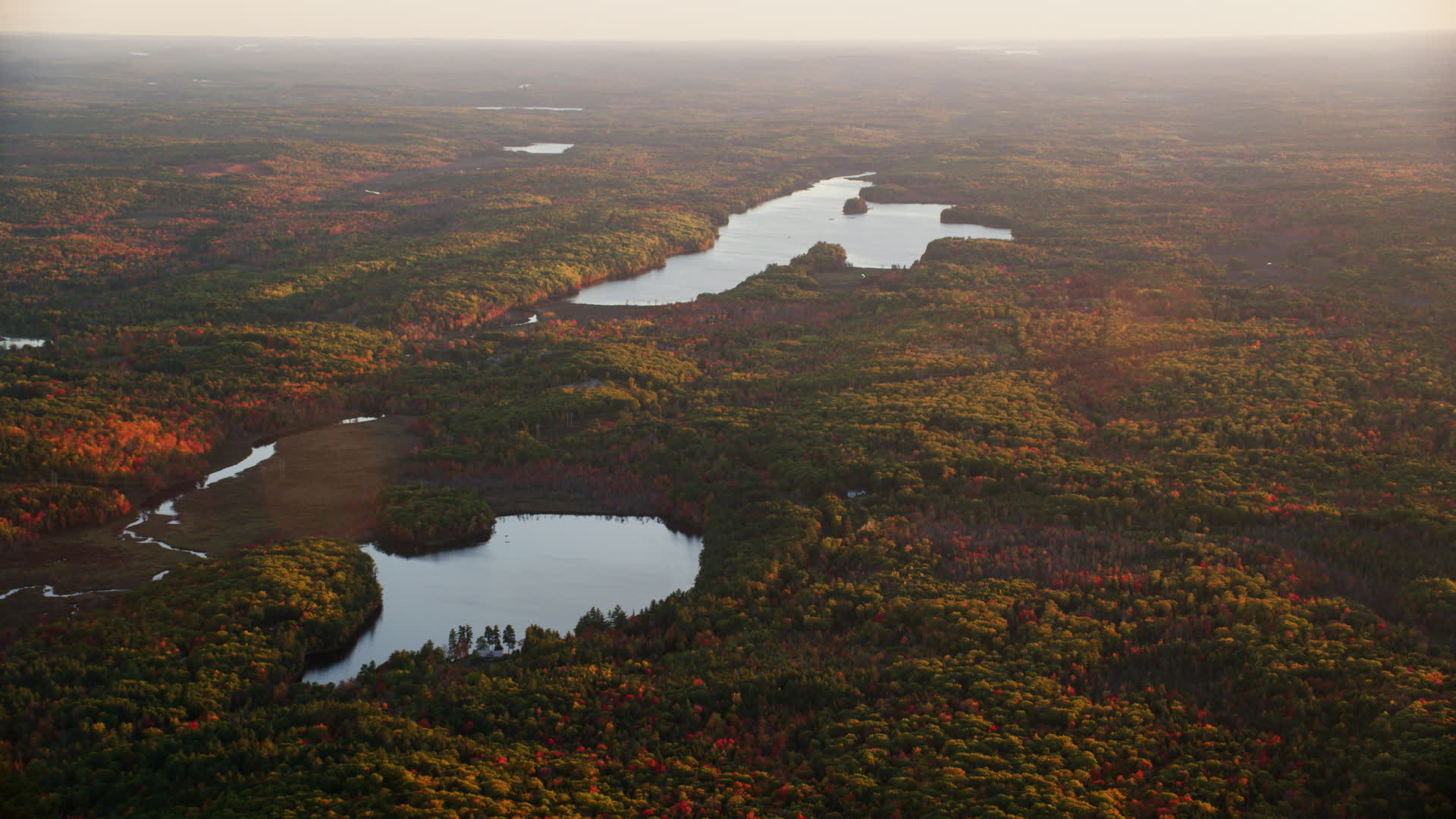 5.5K stock footage aerial video flying by James Pond and Long Pond