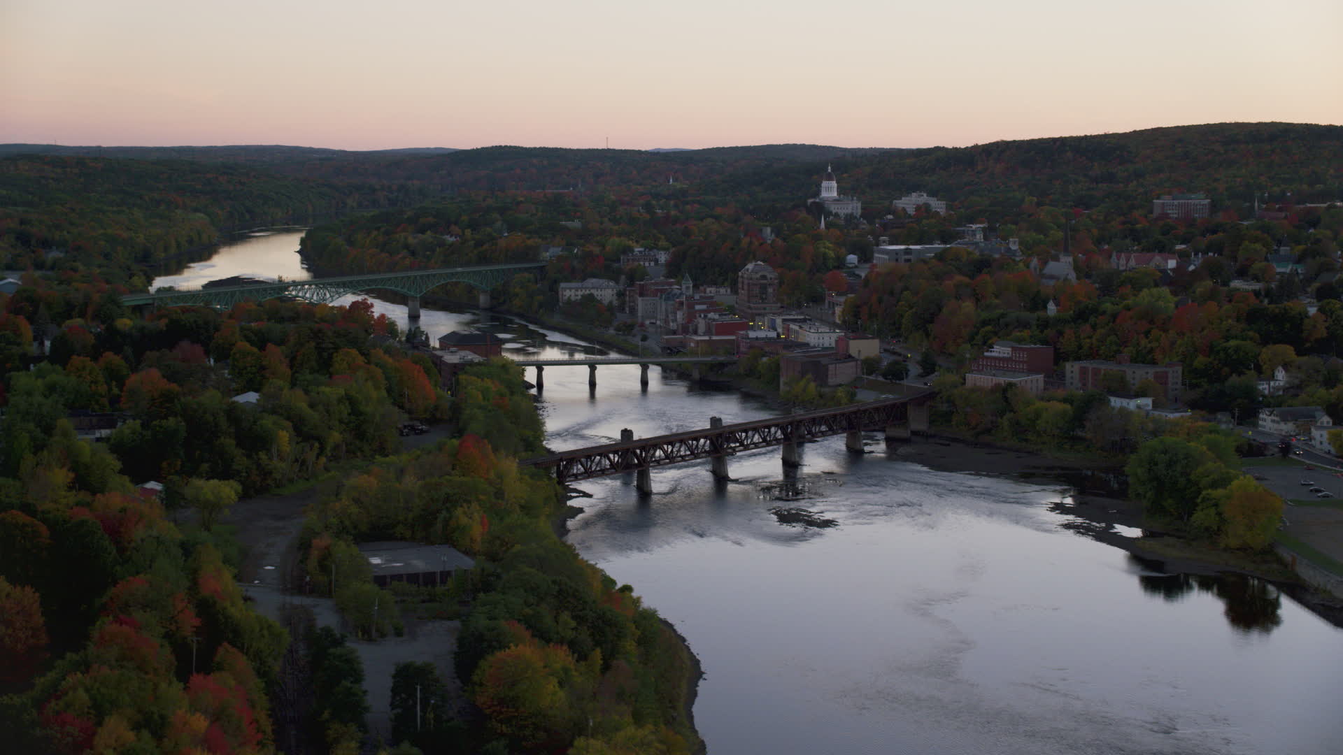 5.5K stock footage aerial video flying by small bridge, Kennebec River