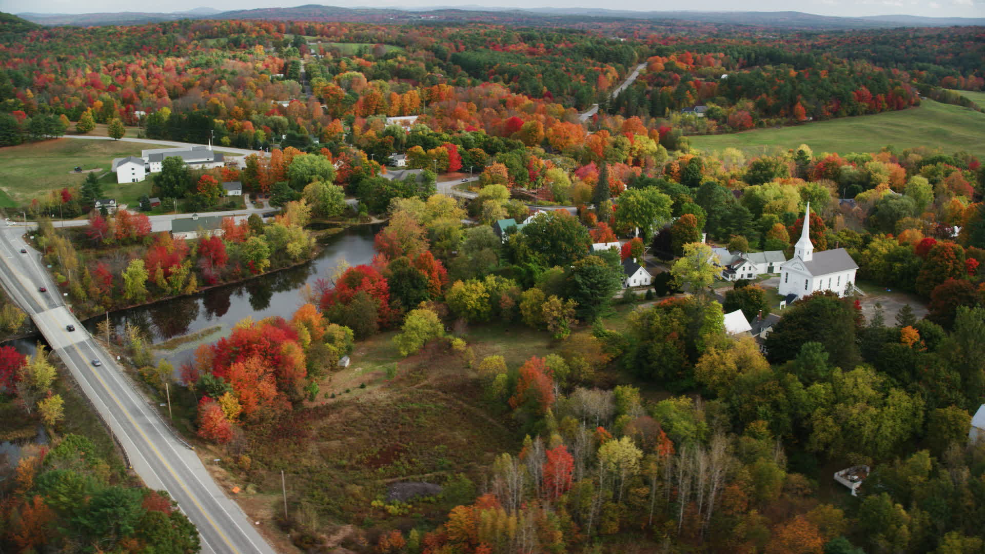 6K stock footage aerial video orbiting a small town, church, colorful