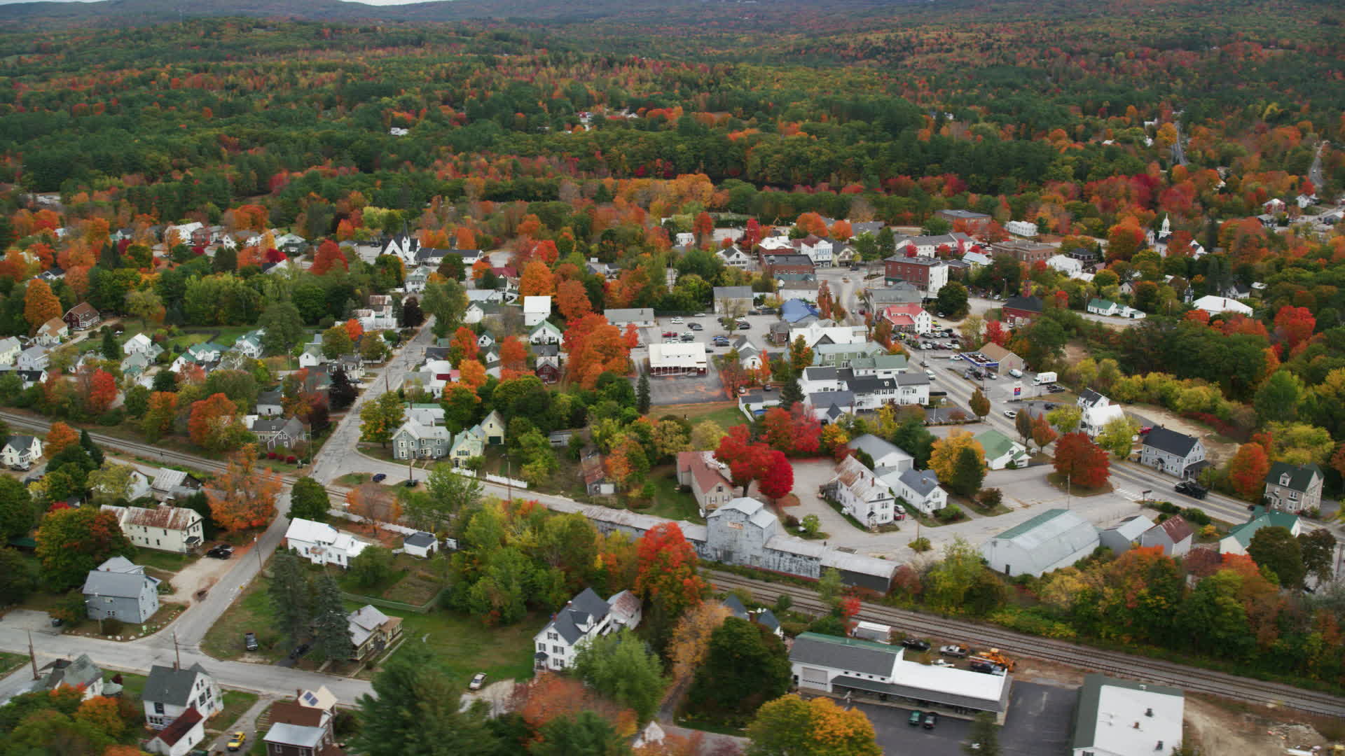 6K stock footage aerial video orbiting small rural town with colorful
