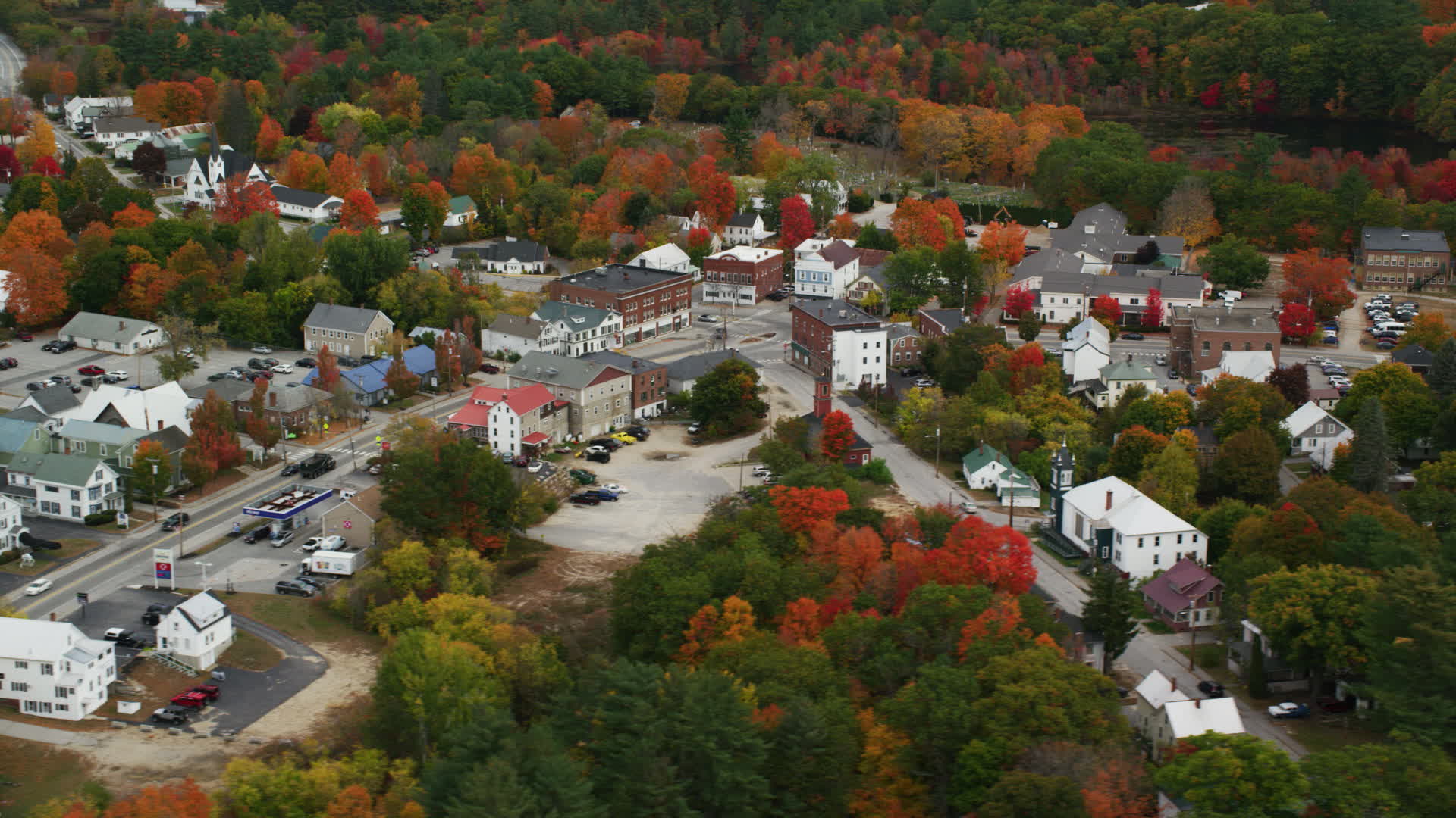 5.5K stock footage aerial video orbiting small rural town with colorful