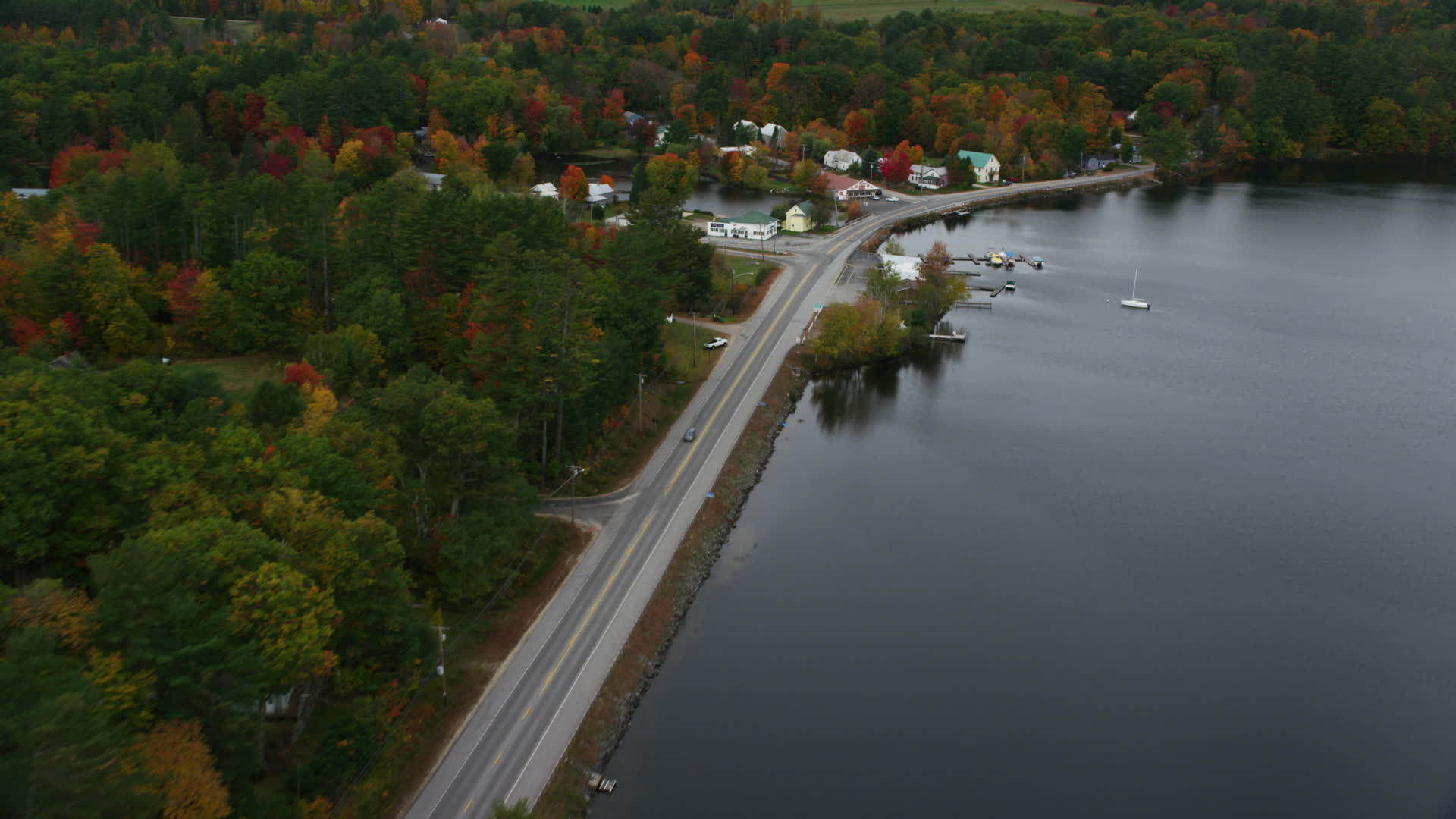 5.5K stock footage aerial video flying over Lake Road, Pennesseewassee