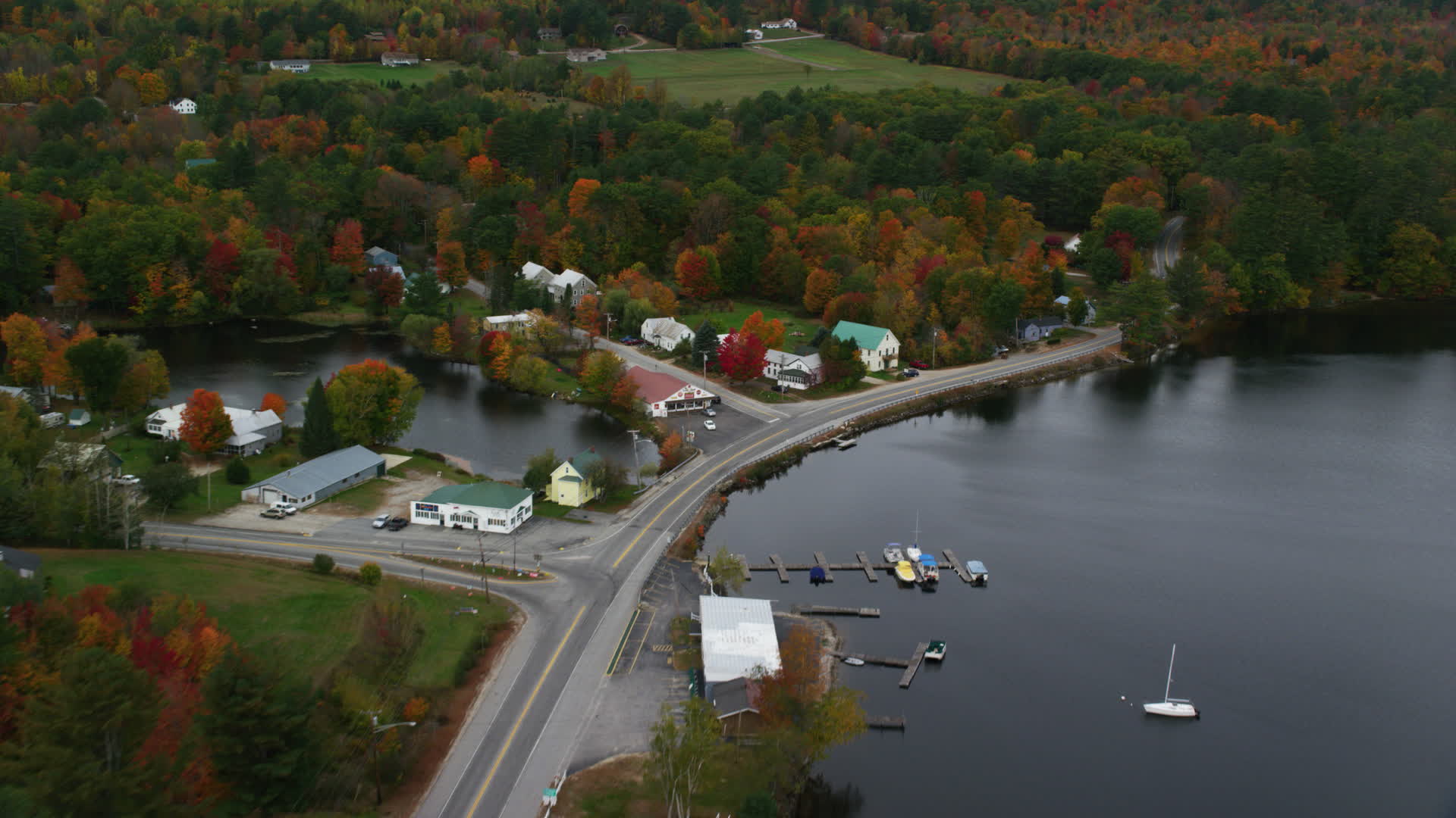 5.5K stock footage aerial video tilting down on waterfront rural homes