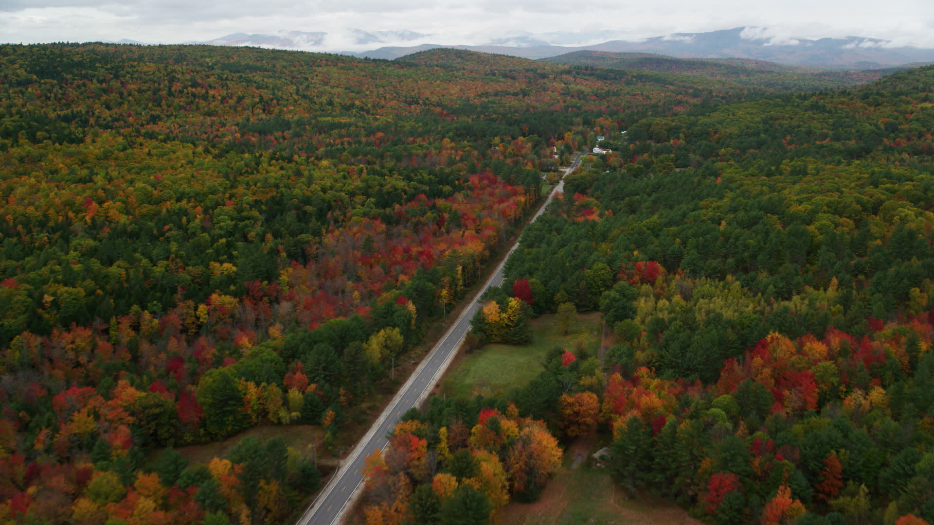 6K stock footage aerial video flying over Maine Street, rural homes