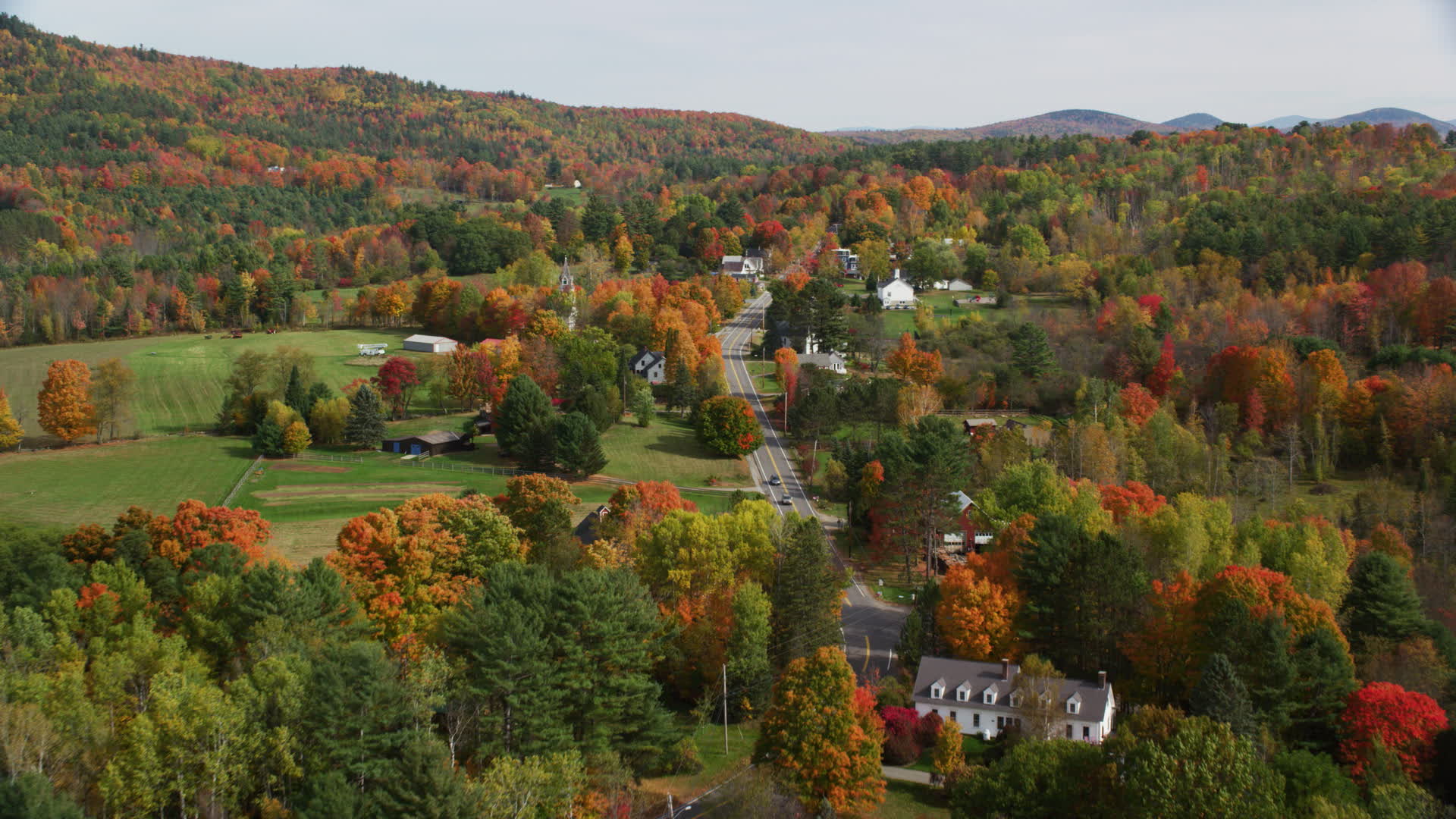 5.5K stock footage aerial video flying over small rural town, approach