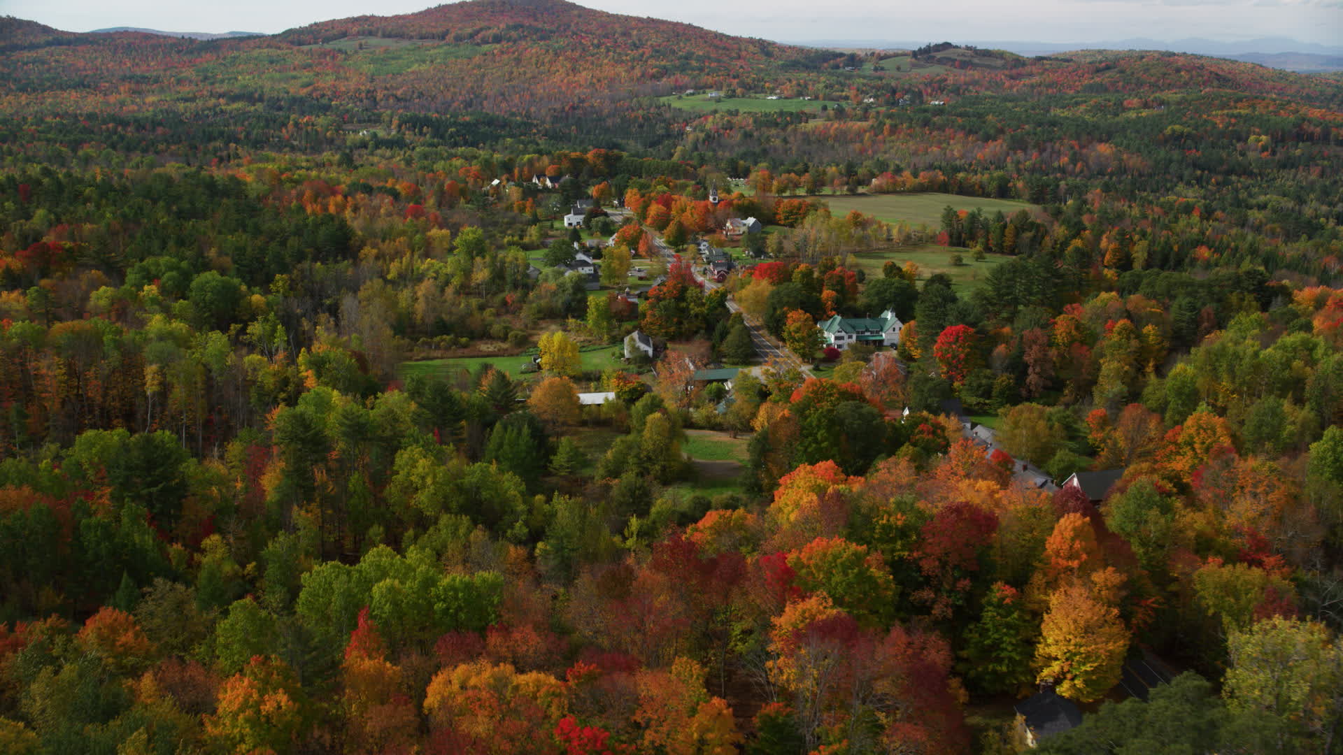 6K stock footage aerial video approaching a small rural town, colorful