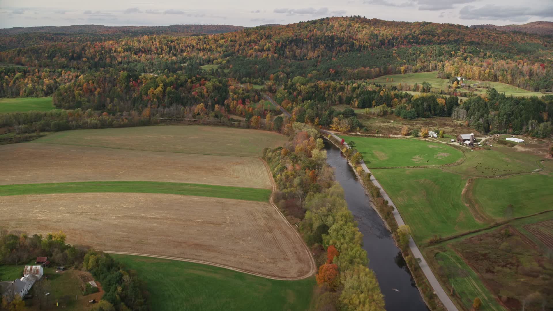 6K stock footage aerial video flying over Ammonoosuc River, by farms