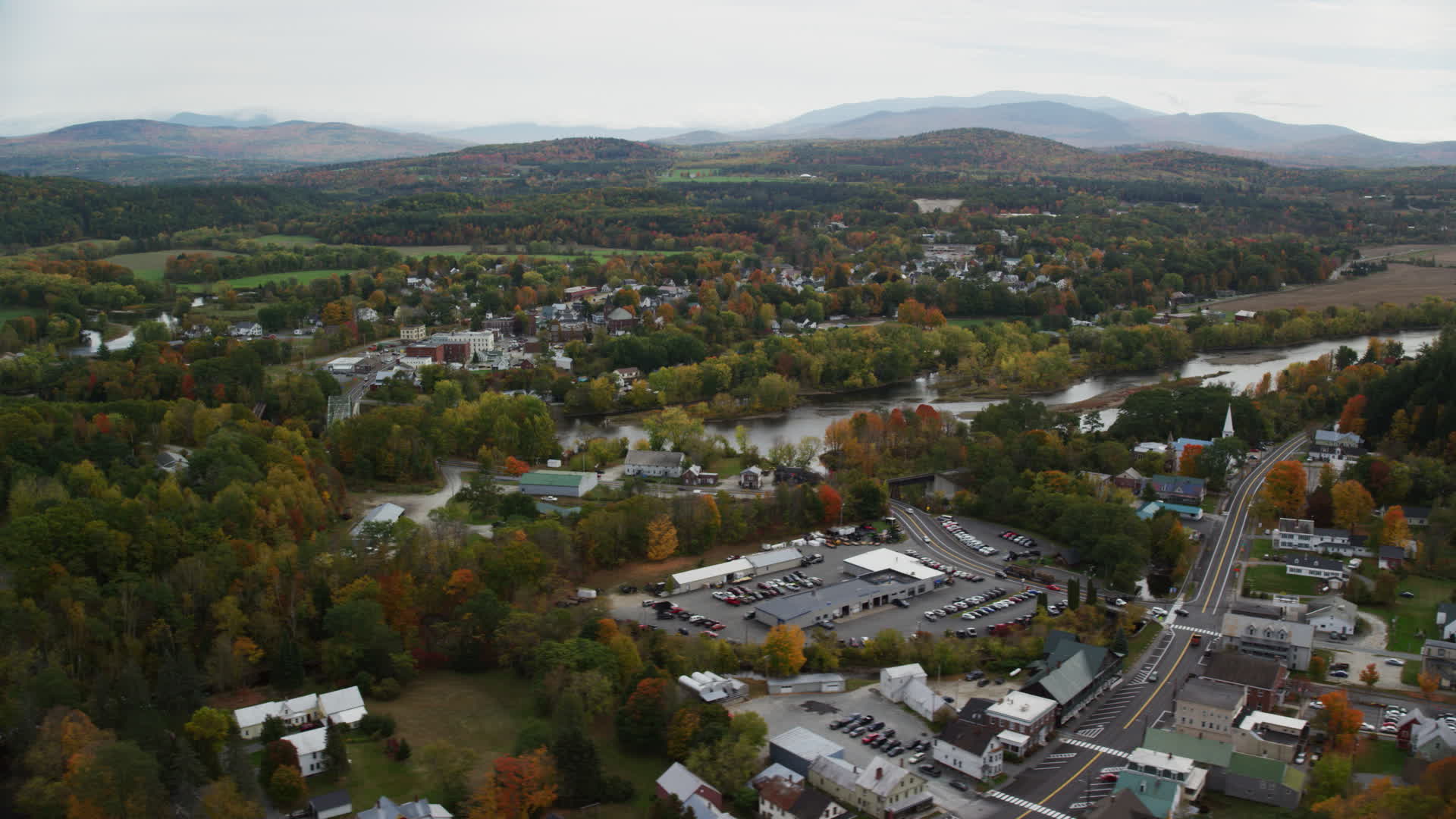 6K stock footage aerial video orbiting small rural town, autumn, Woodsville, New Hampshire and