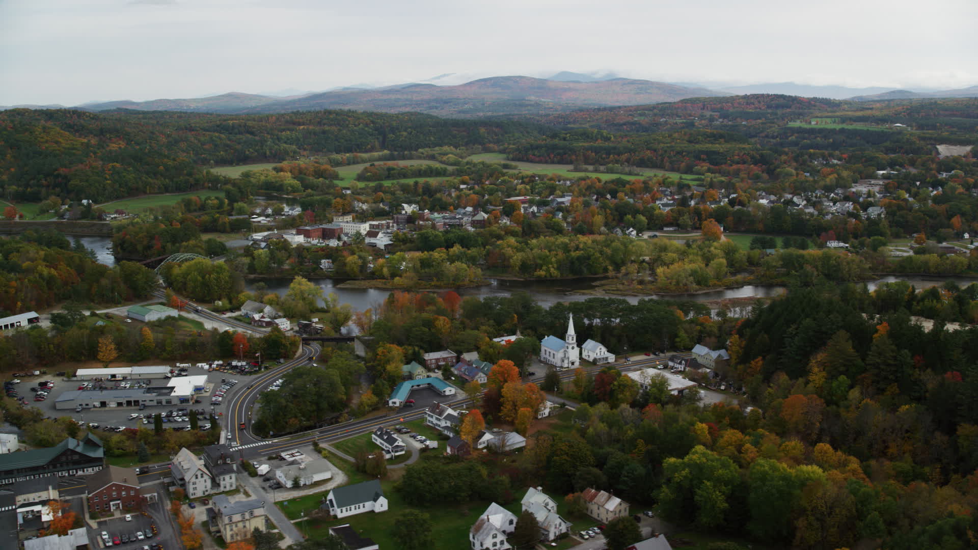 5.5K stock footage aerial video flying by small rural town, colorful