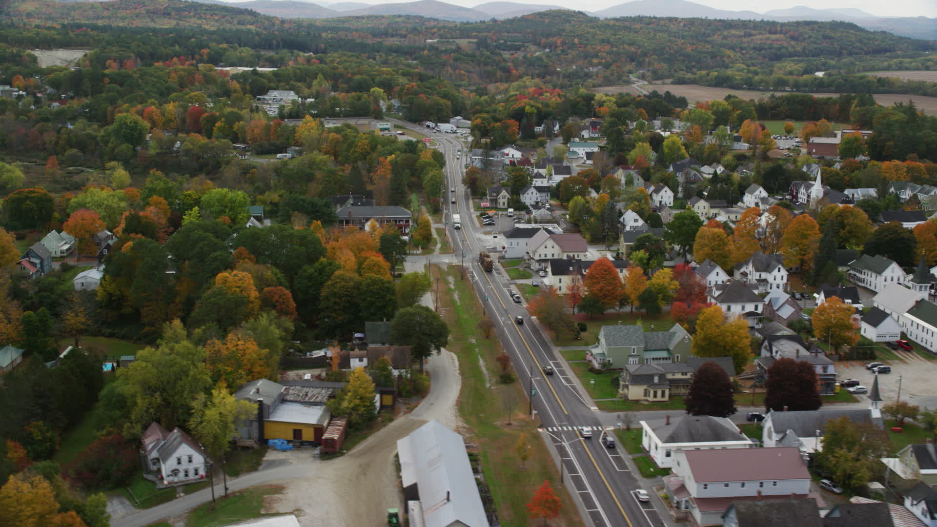 5.5K stock footage aerial video flying over Central Street, by a small