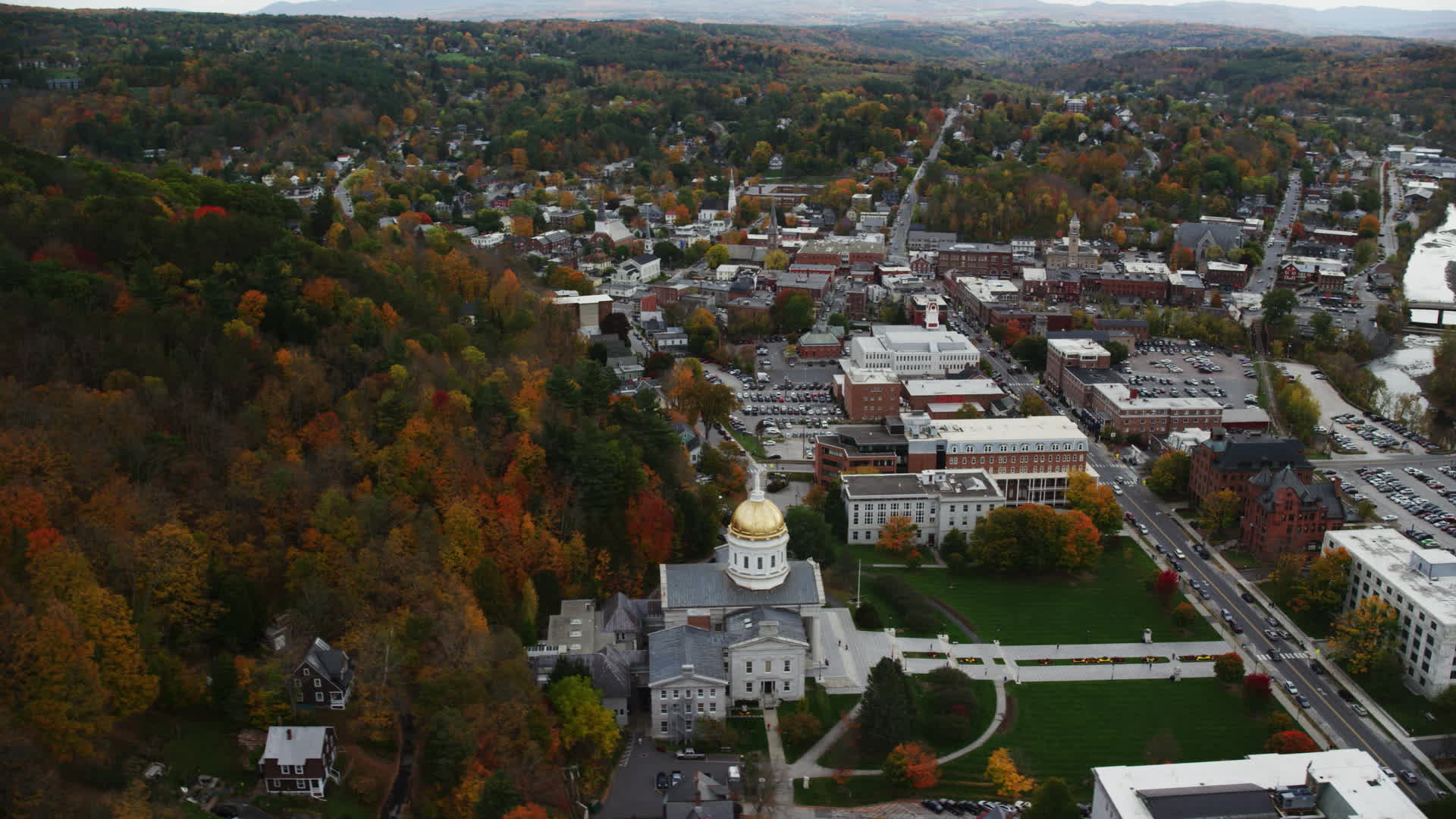 5.5K stock footage aerial video orbiting Vermont State House in autumn