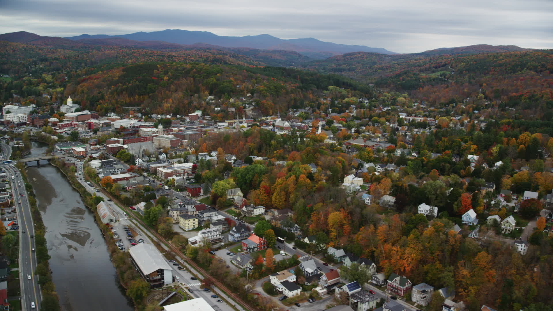5.5K stock footage aerial video flying by downtown in autumn, Winooski
