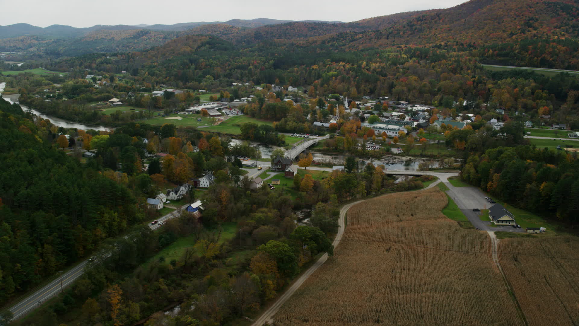 5.5K stock footage aerial video approaching White River, small bridge