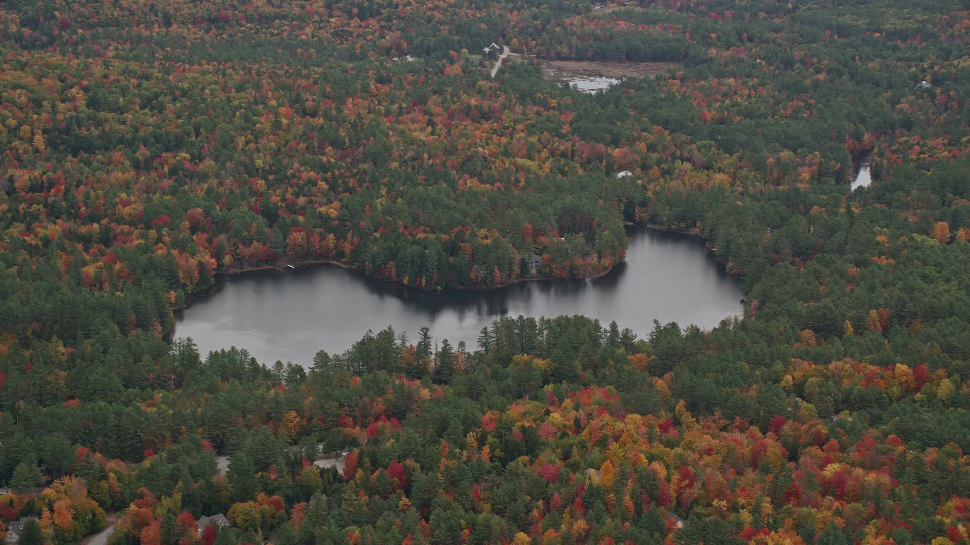 5.5K stock footage aerial video flying by Chase Pond, waterfront homes