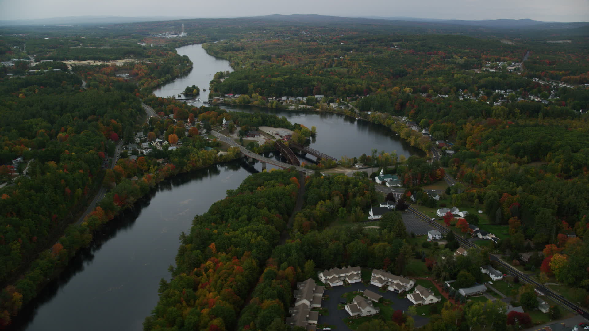 5.5K stock footage aerial video orbiting small bridges, Merrimack River