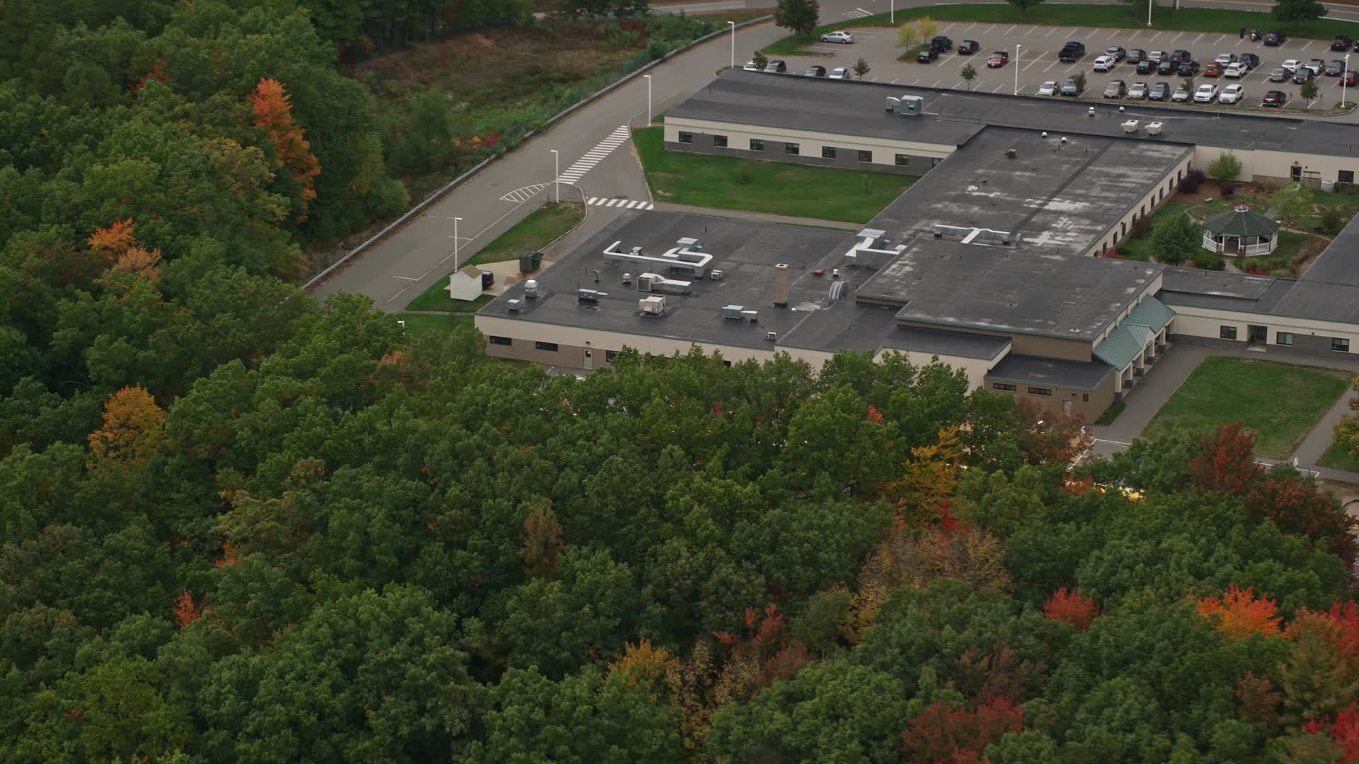 5.5K stock footage aerial video flying by Hooksett Memorial School