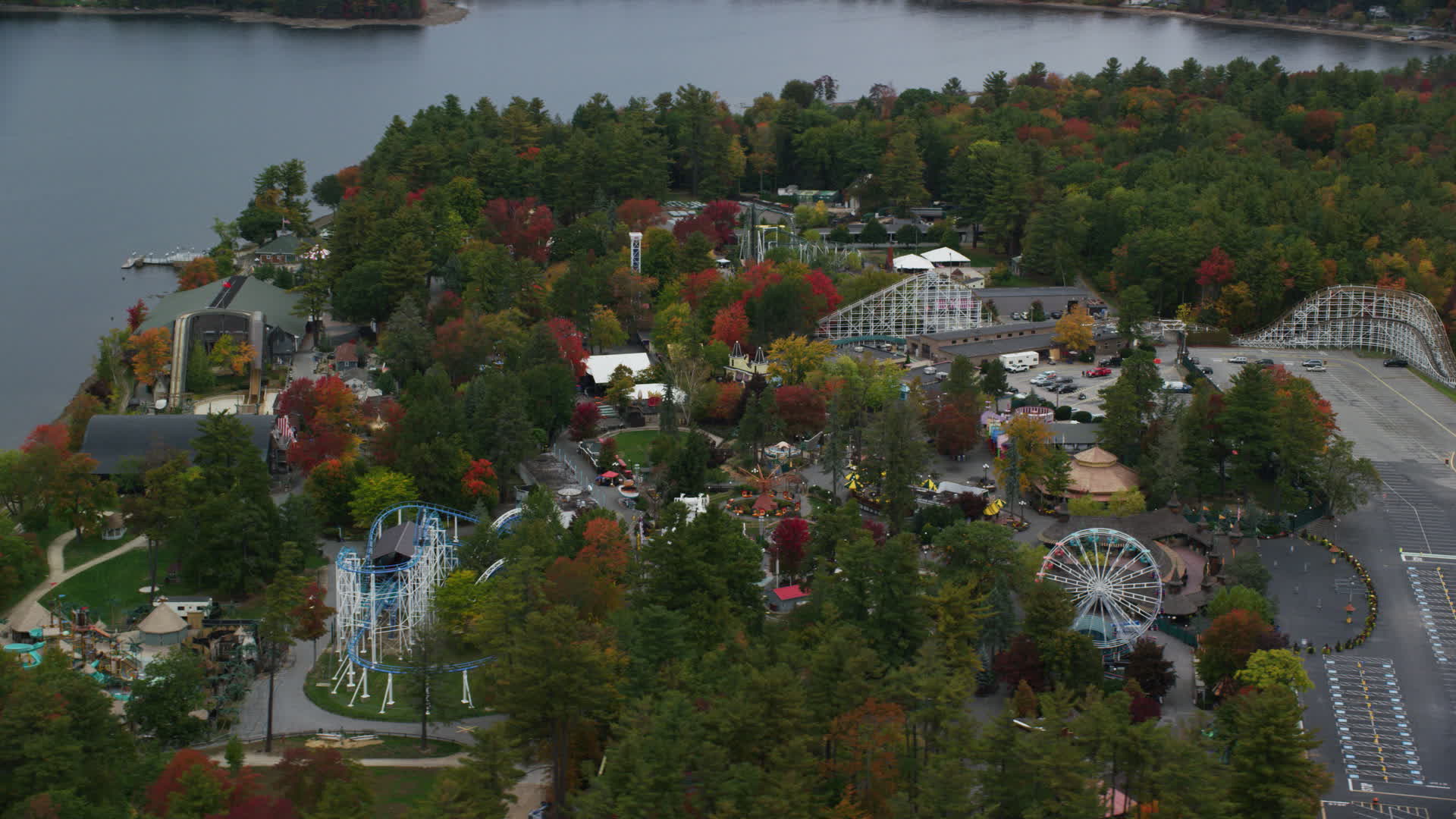 5.5K aeria video orbiting colorful foliage, Canobie Lake Park, autumn