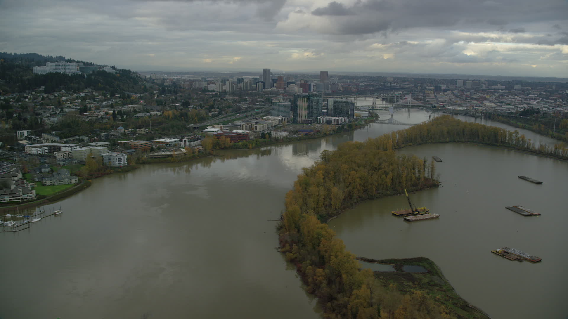 6K stock footage aerial video following Willamette River over Ross Island toward South