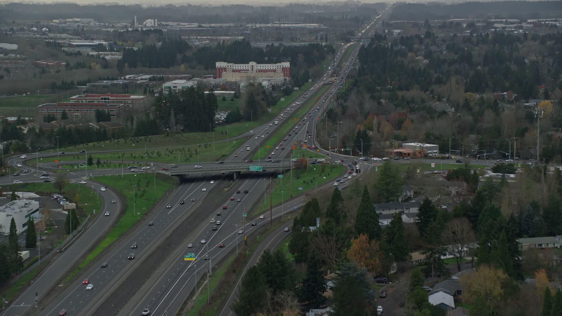 5.5K stock footage aerial video following Highway 26 with light traffic through Hillsboro