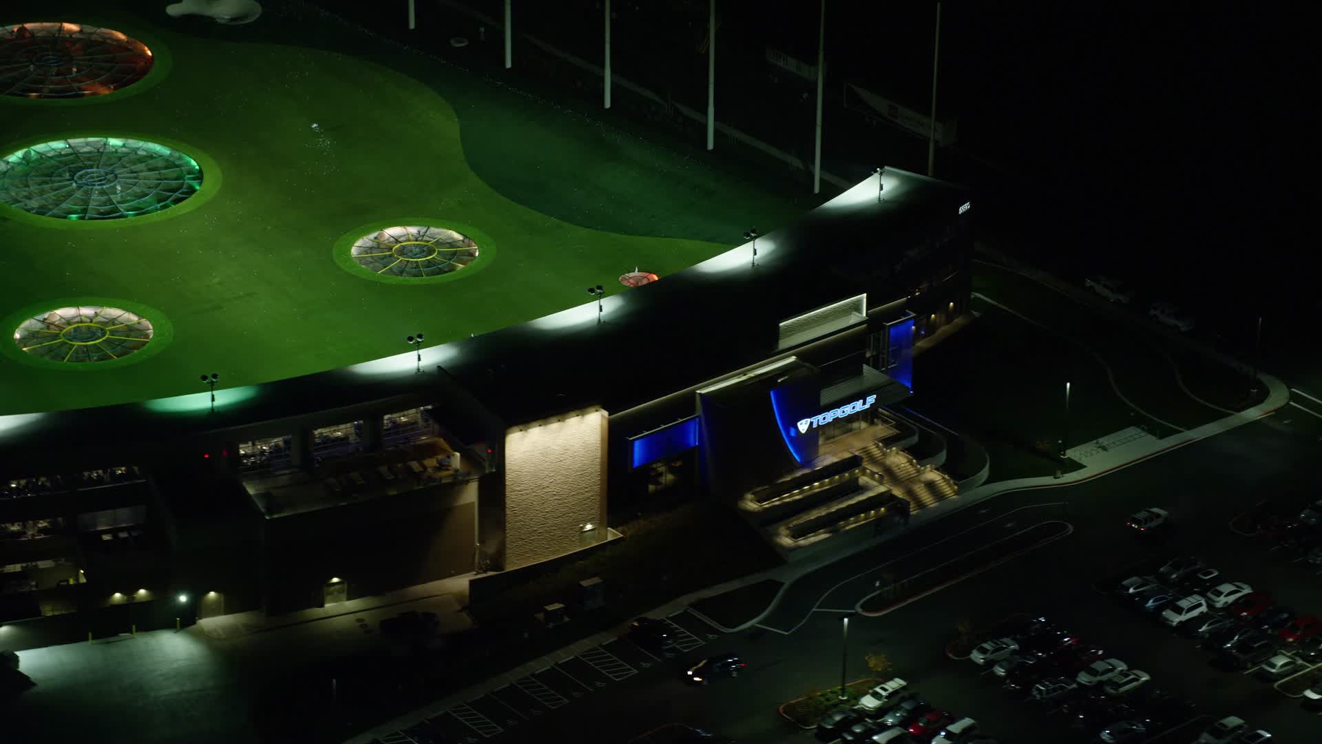 5.5K stock footage aerial video flying away from the Topgolf course in Hillsboro, Oregon at