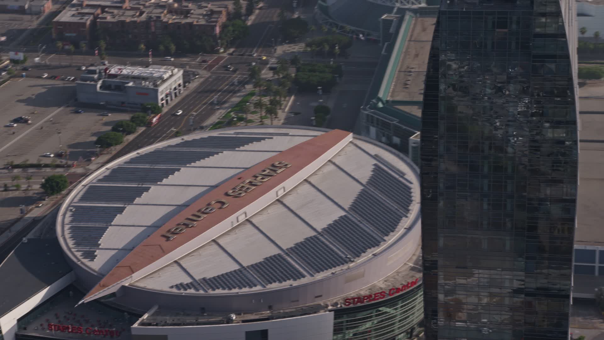 4K stock footage aerial video flying by Staples Center and the top of the RitzCarlton Hotel