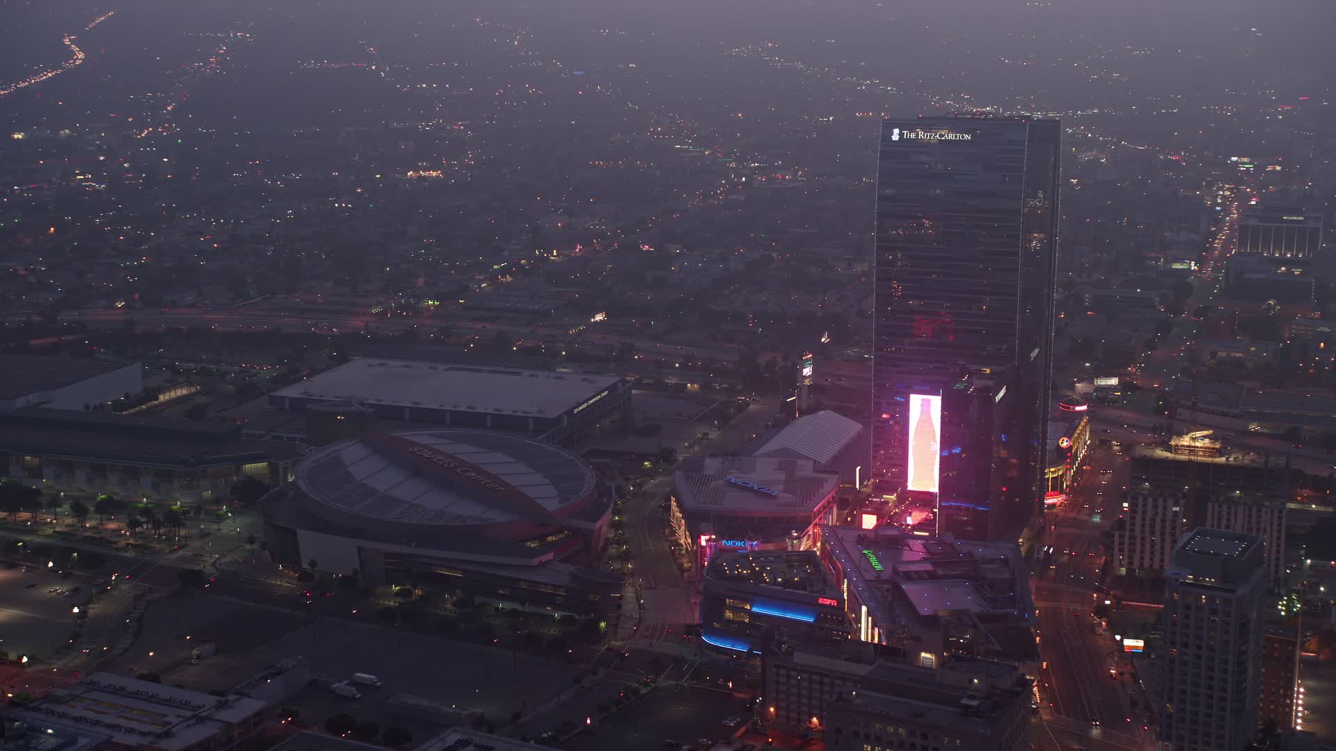 4K stock footage aerial video approaching Staples Center panning to The RitzCarlton, Los