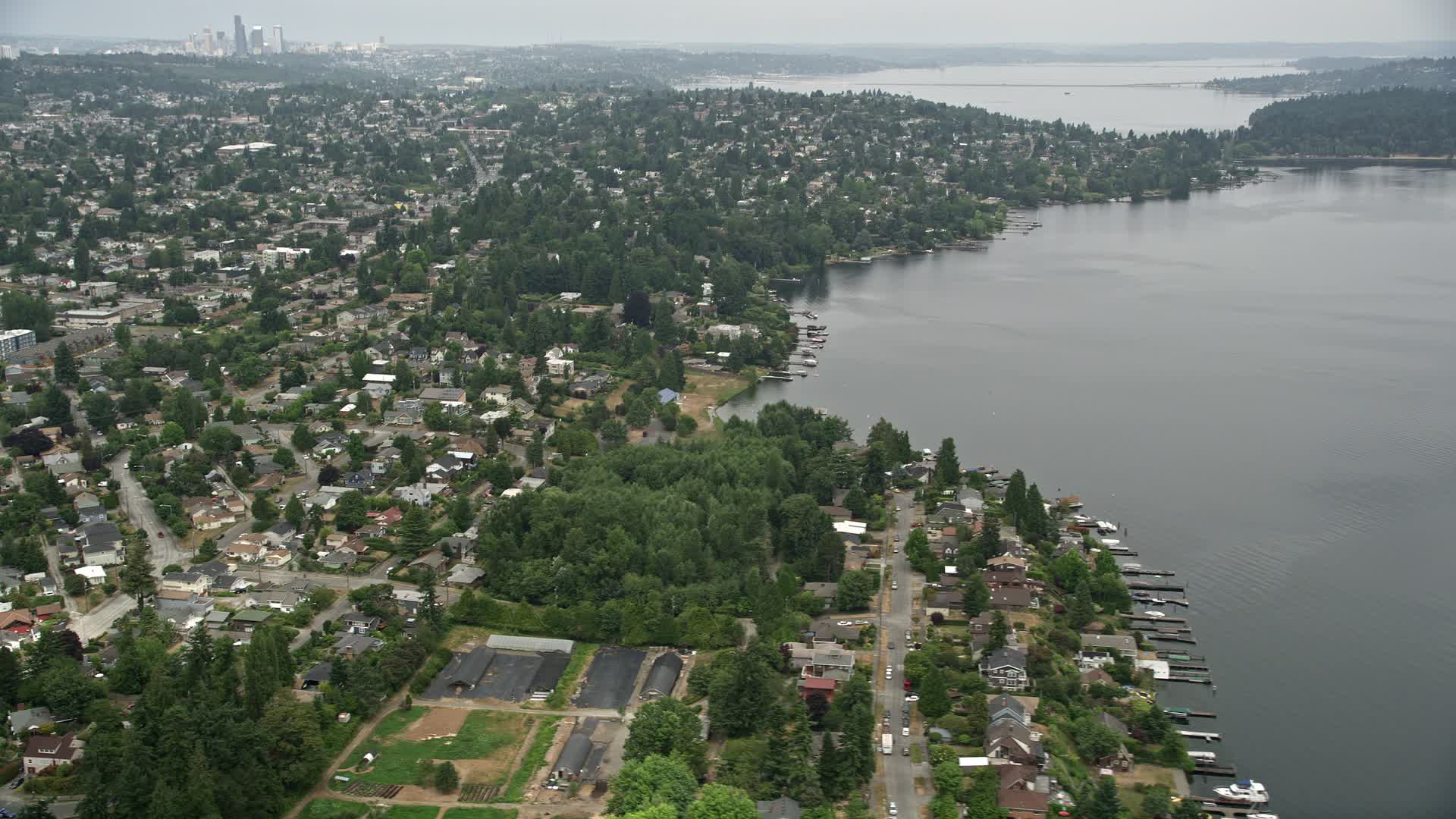 5K stock footage aerial video of suburban homes near the lake