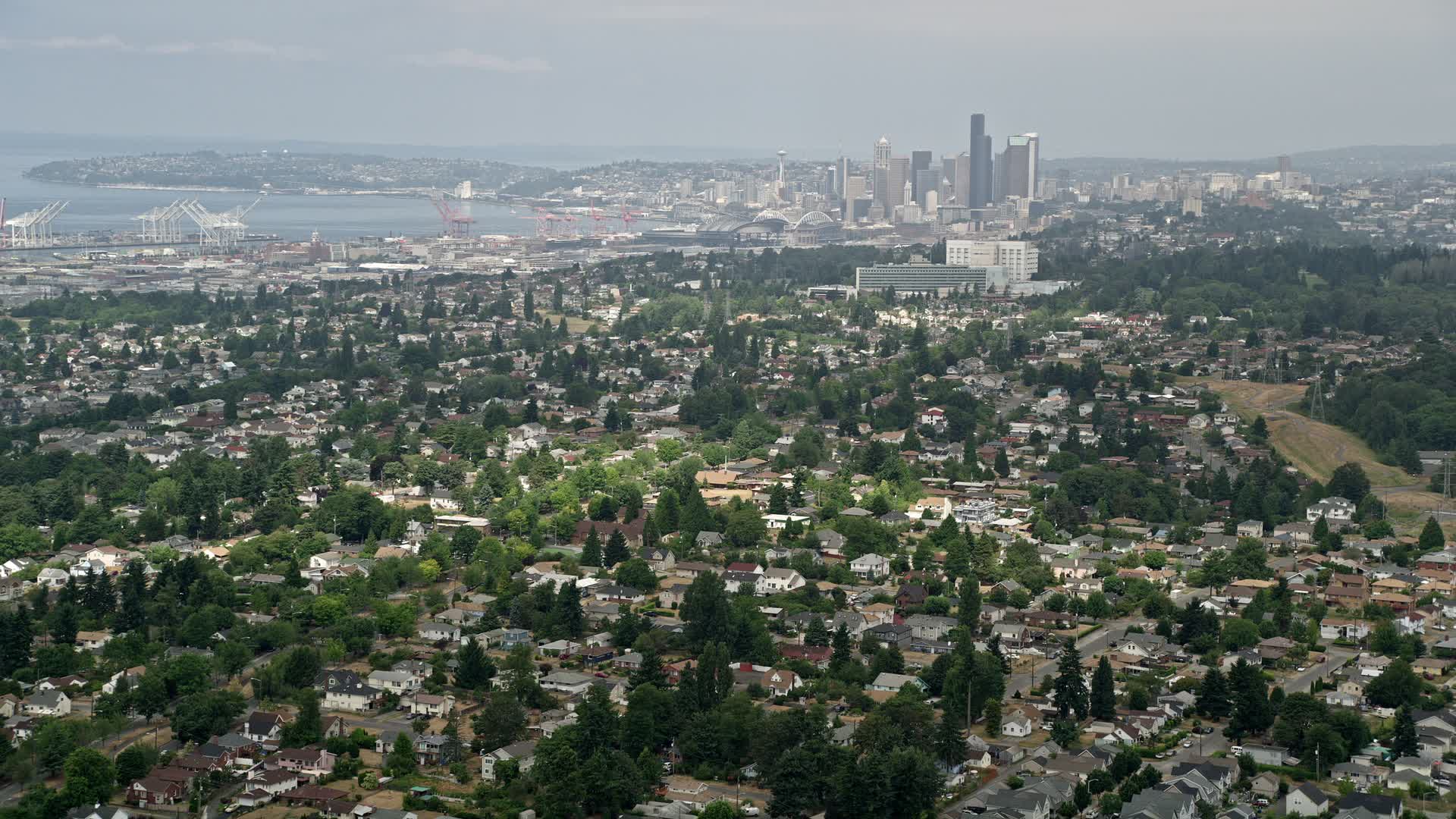 5K stock footage aerial video of Seattle skyline seen from residential