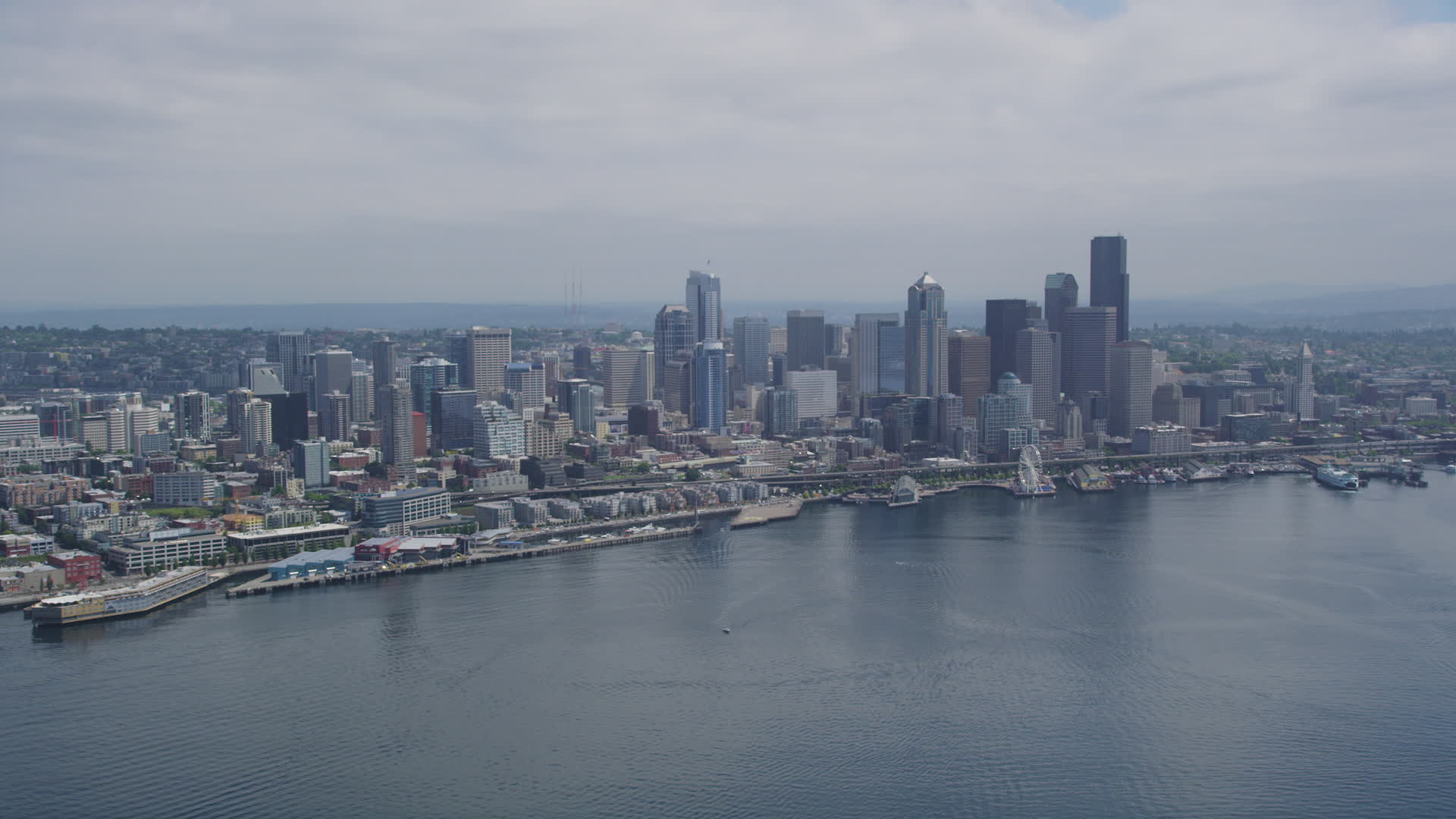 5k stock footage aerial video approaching the waterfront and downtown seattle skyline from elliott bay washington aerial stock footage ax45_072 seattle city scape